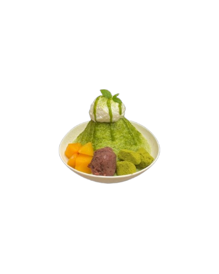 Matcha green tea shaved ice dessert topped with a scoop of whipped cream and matcha drizzle, served with mango chunks and green mochi on a white plate against a black background.