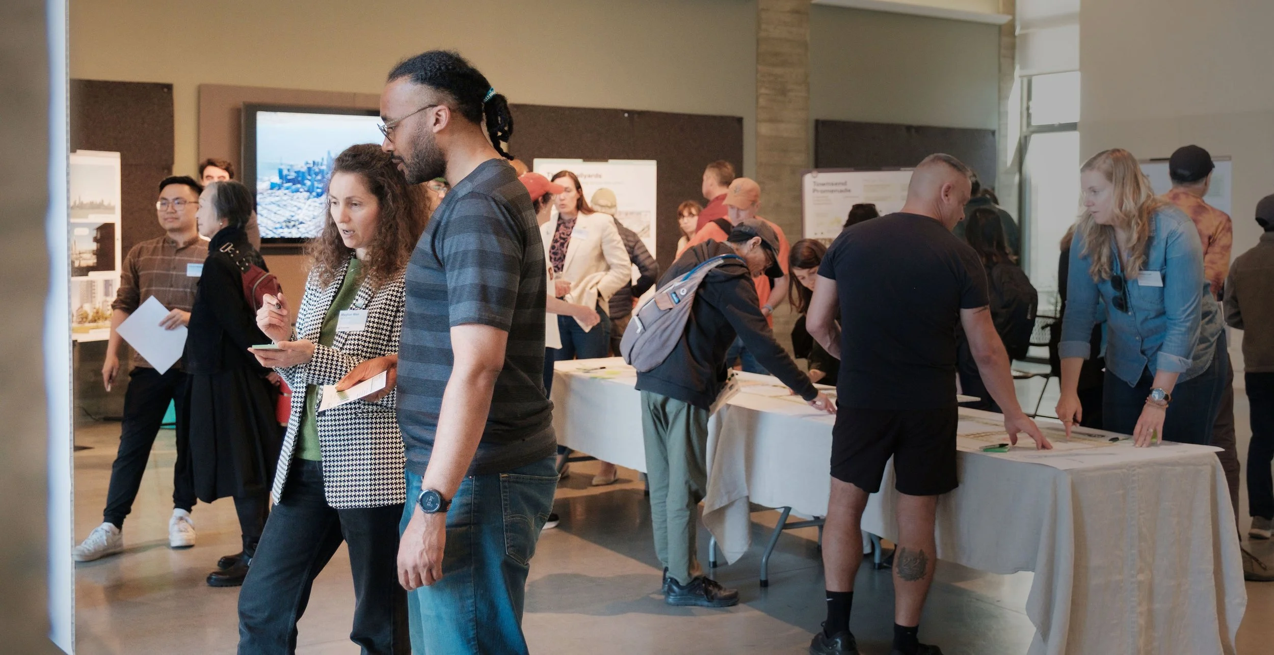 Community members give feedback at an in-person workshop.