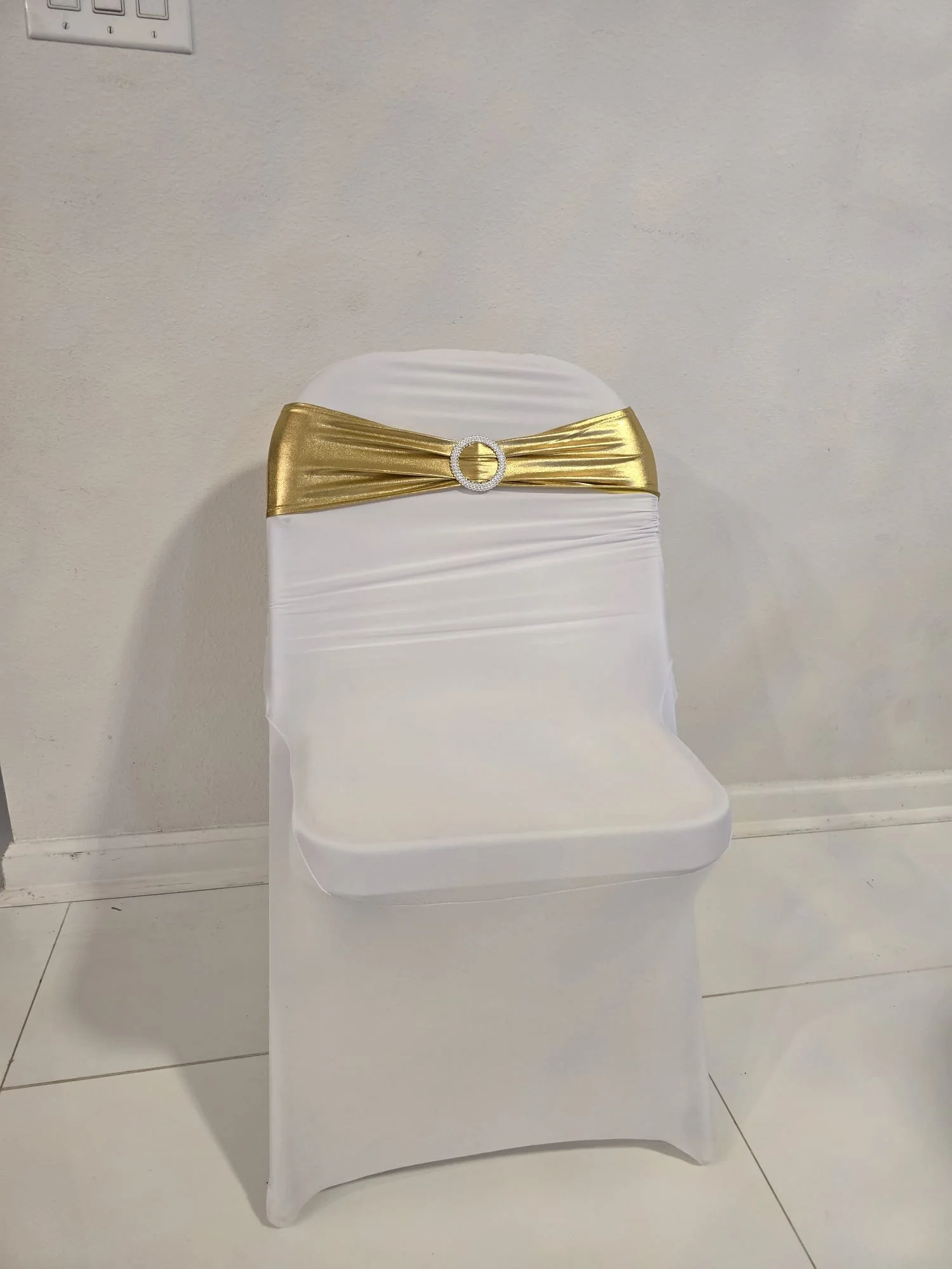 White Spandex Chair Cover with Gold Sash & Buckle Rental
