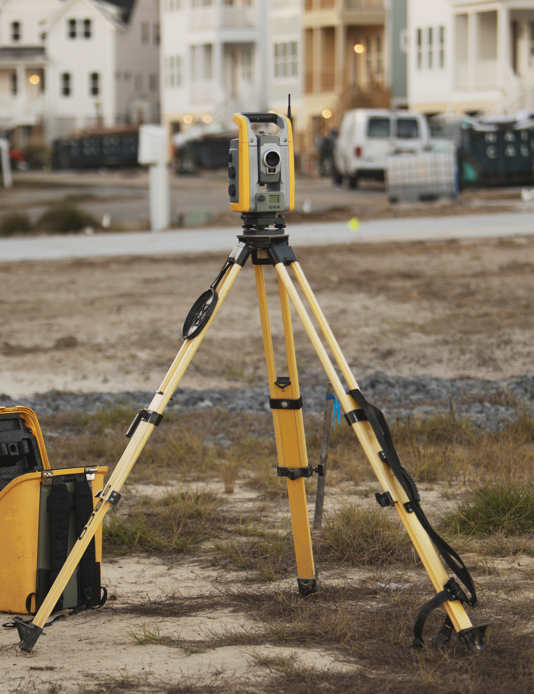Land surveying equipment positioned at a development site