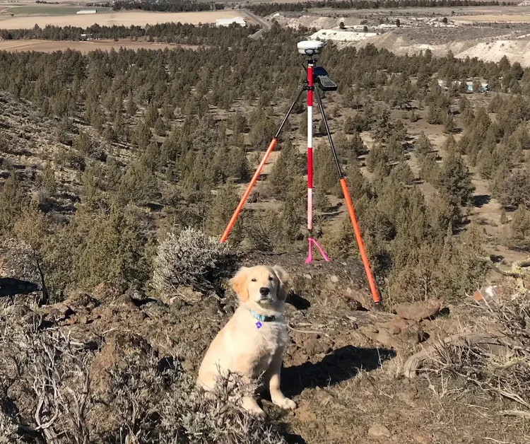Young Ozzy with surveying gear