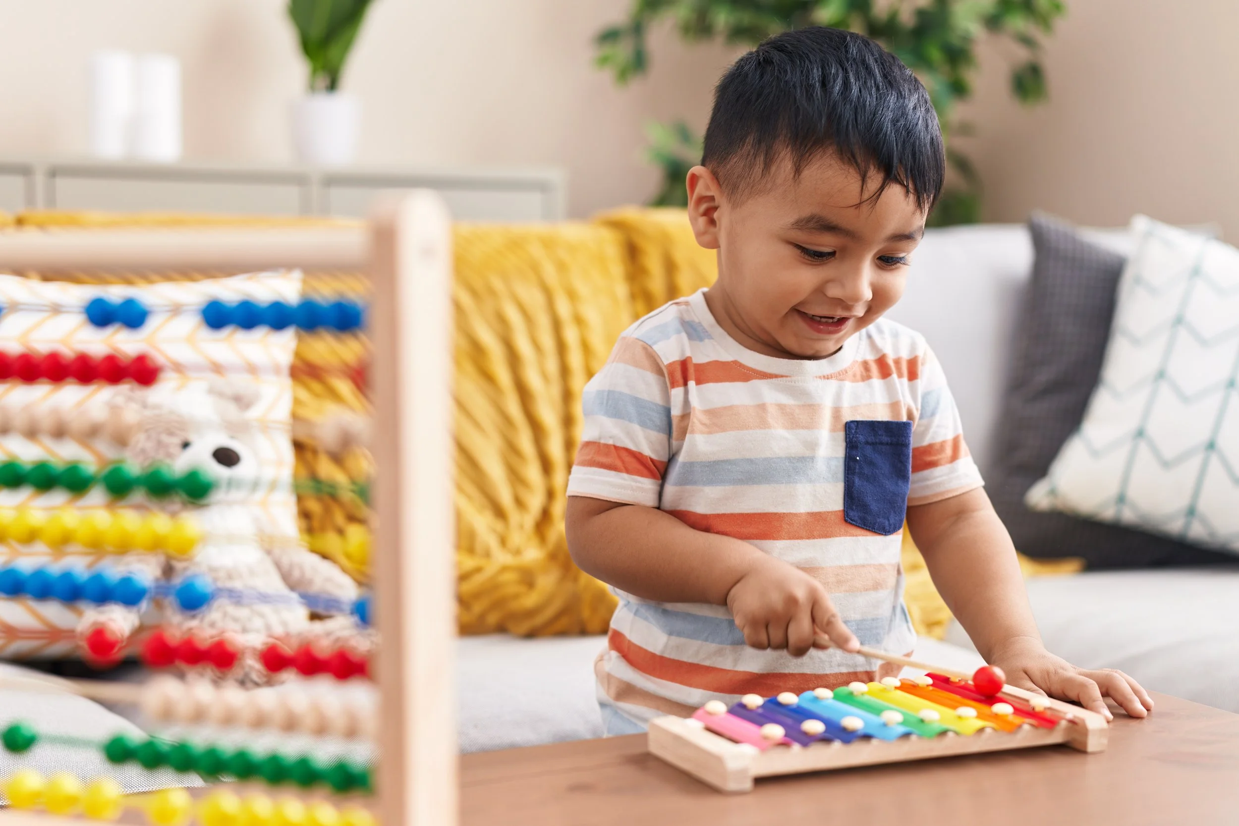 Young child developing fine motor and play skills during a pediatric occupational therapy session in Athens, GA.