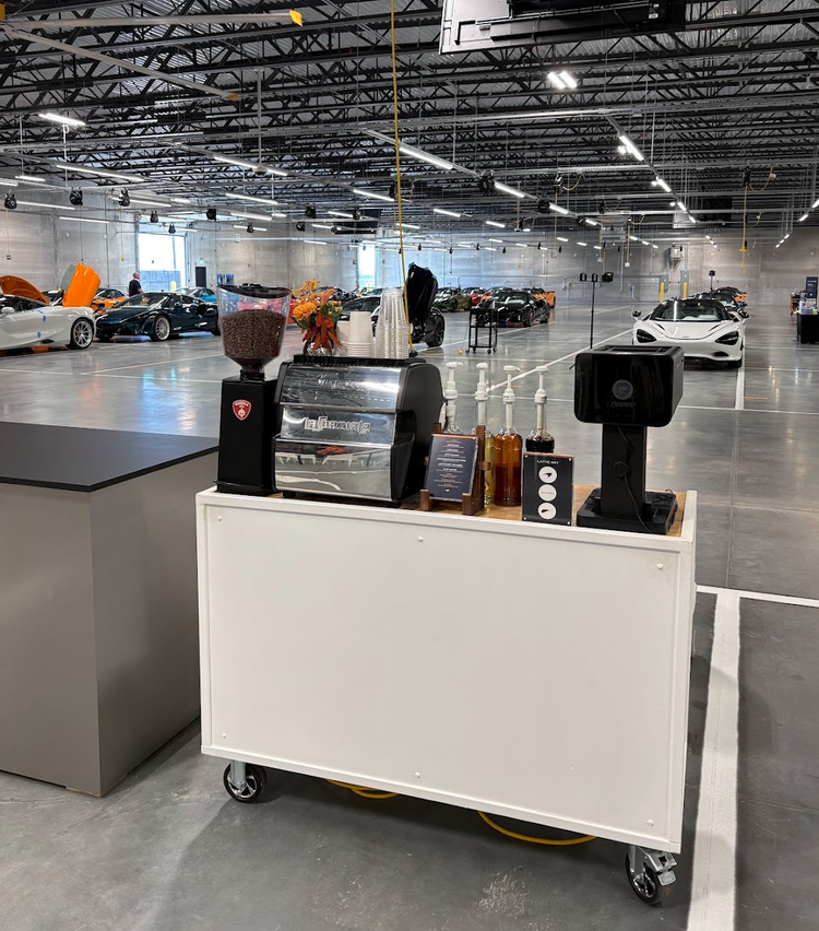 Coffee catering cart inside an automotive event venue