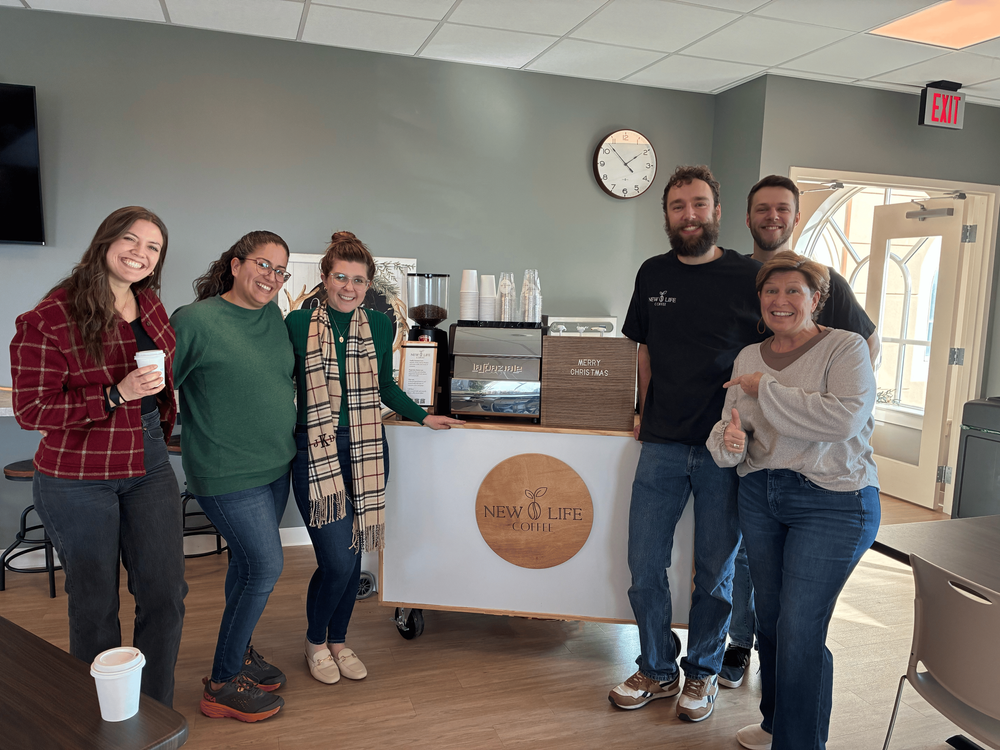 Lancaster County guests and New Life Coffee Company baristas gathered around a mobile espresso cart