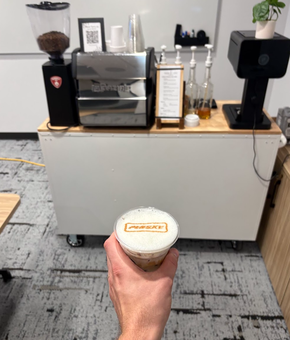 Penske logo printed on the foam of a custom coffee during an executive leadership meeting in Reading, Pennsylvania