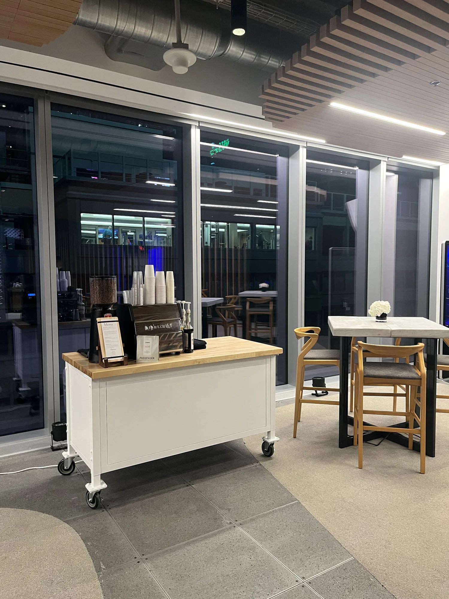 New Life Coffee Company mobile espresso bar ready for evening service at a modern indoor venue