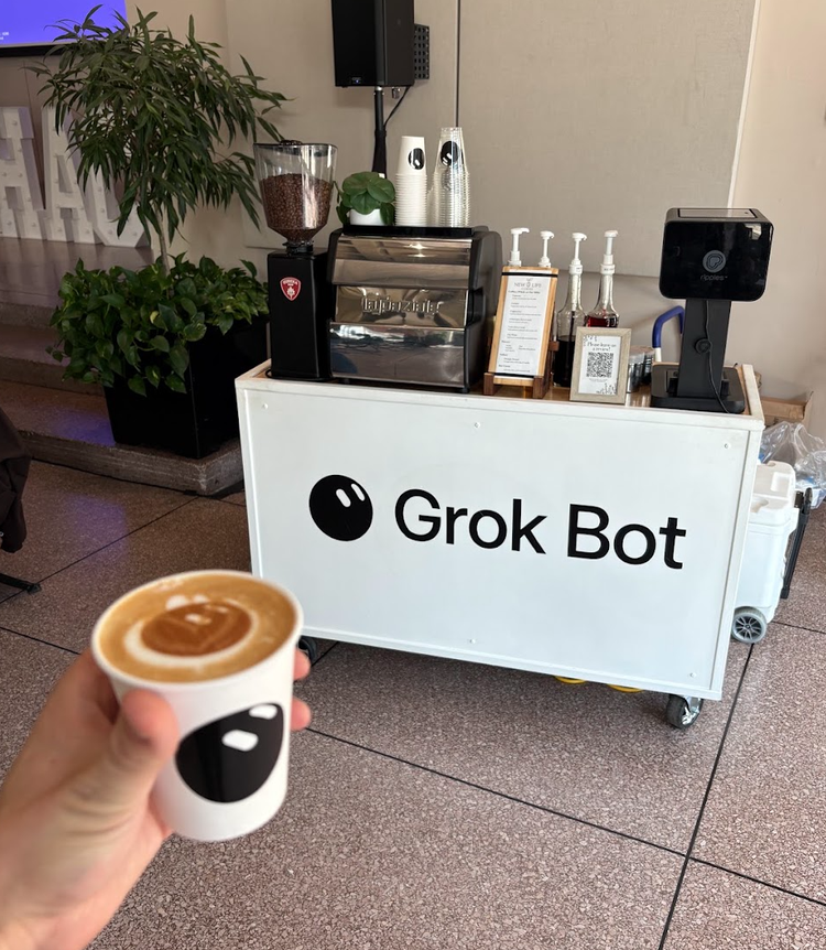 Grok Bot branded espresso cart and custom latte art