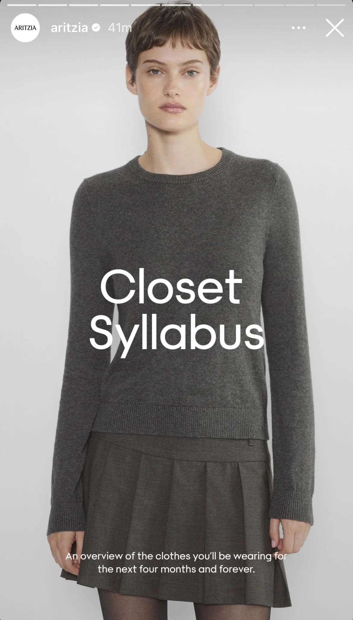 A woman in a gray sweater and plaid skirt standing against a plain background, with caption 'Closet Syllabus' and description 'An overview of the clothes you'll be wearing for the next four months and forever.'