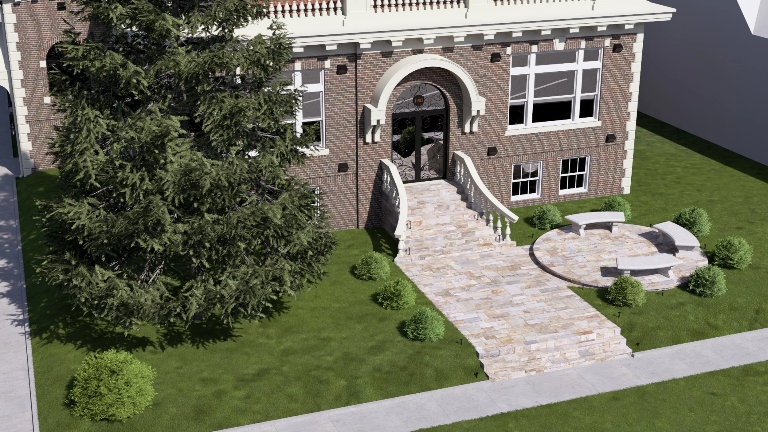 A brick house with white accents, large front steps, and a curved walkway leading to the entrance. There are green bushes and a large pine tree in the yard, along with a circular stone patio with benches.
