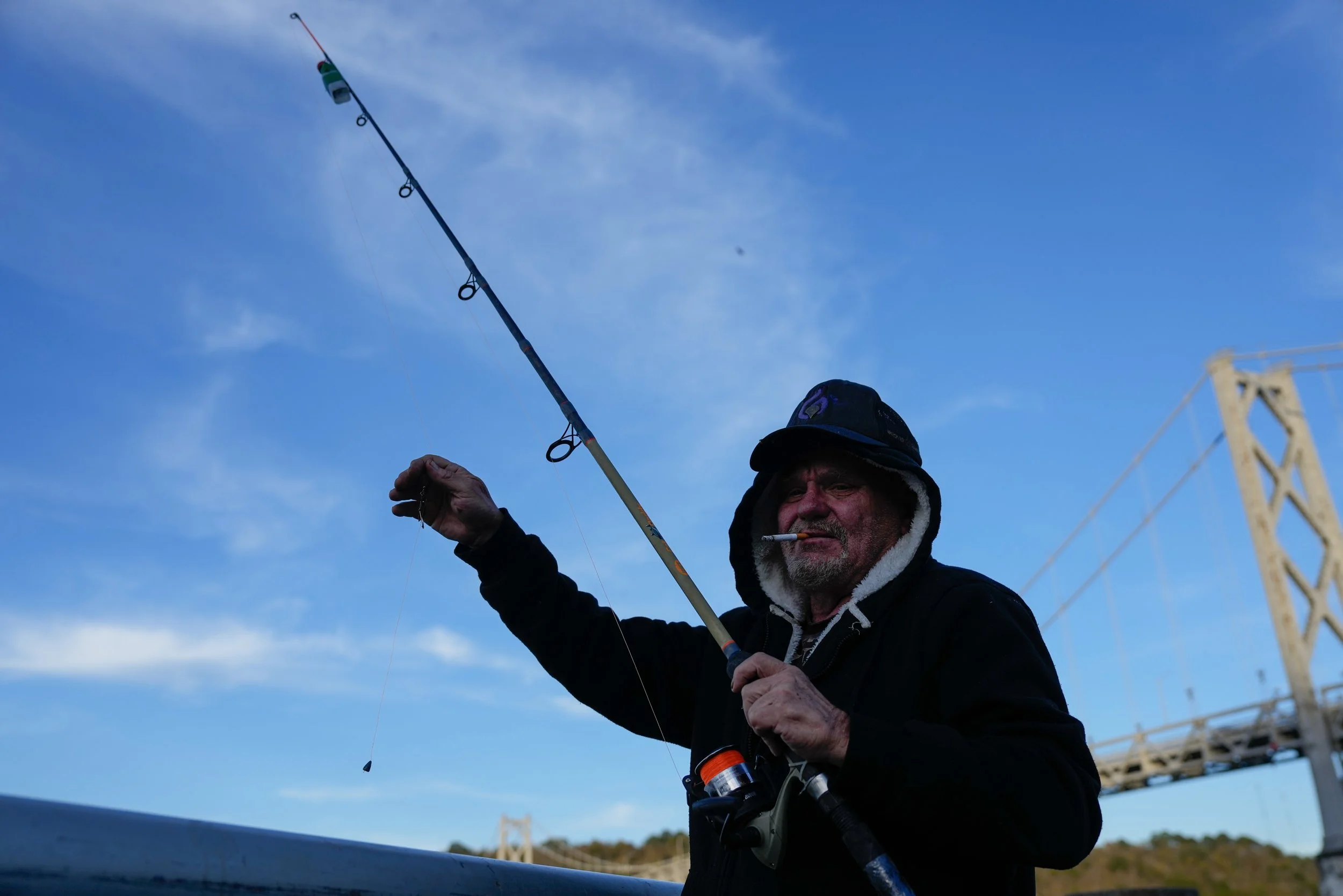 Kelly fishes in the Ohio River in downtown Maysville, K.Y. on Oct. 24, 2025.