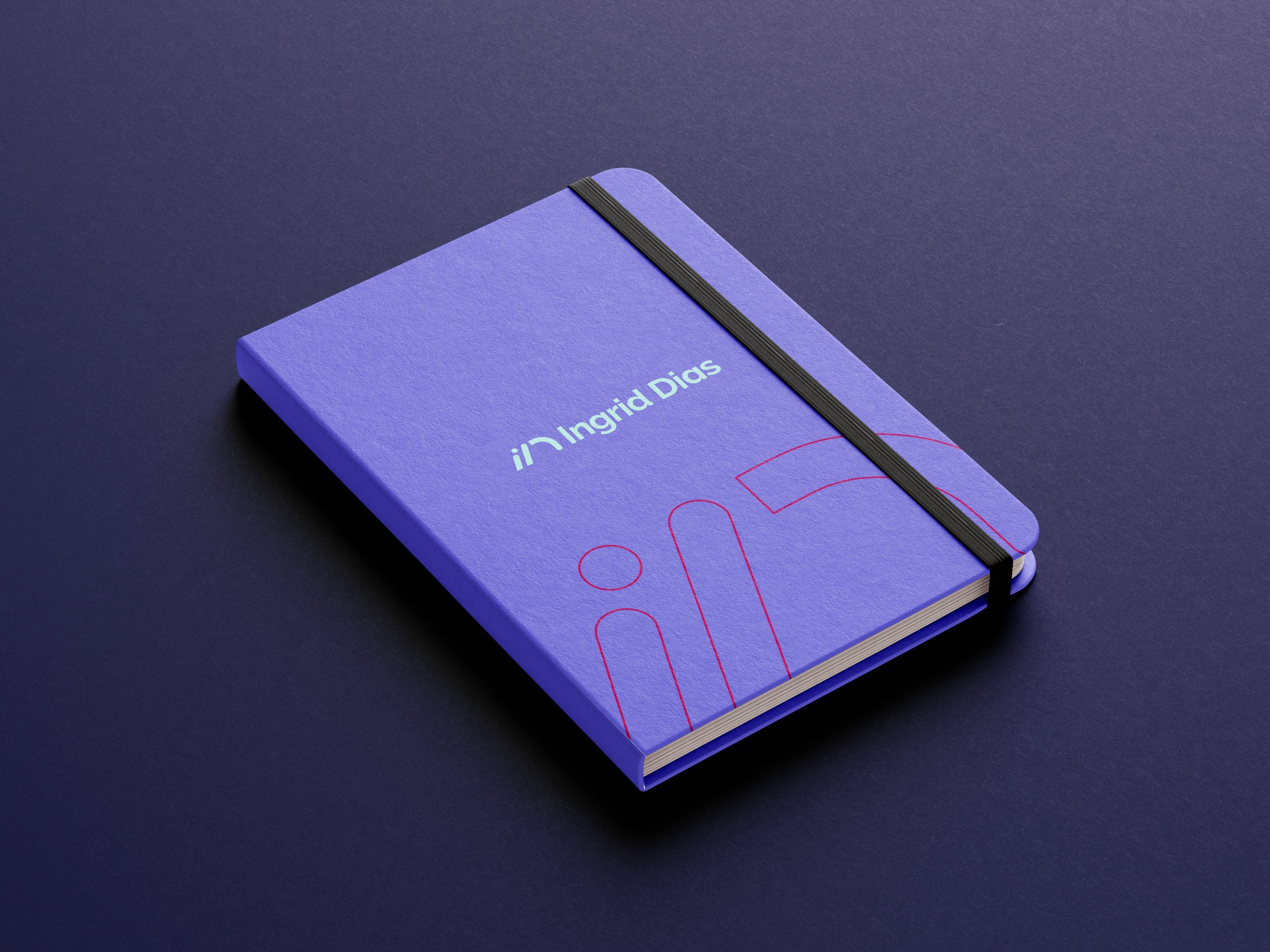 mockup de um moleskine com a identidade visual da marca Ingrid Dias.