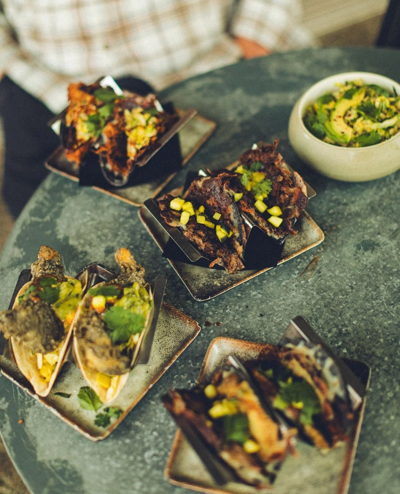 The spread. The whole Comidos Californios lineup on one table,  blue corn fish tacos, smoked birria brisket, quesaditas, and a side of avocado slaw because you're going to need something cool between bites.⁠
⁠
Chef MC built this menu around one idea: