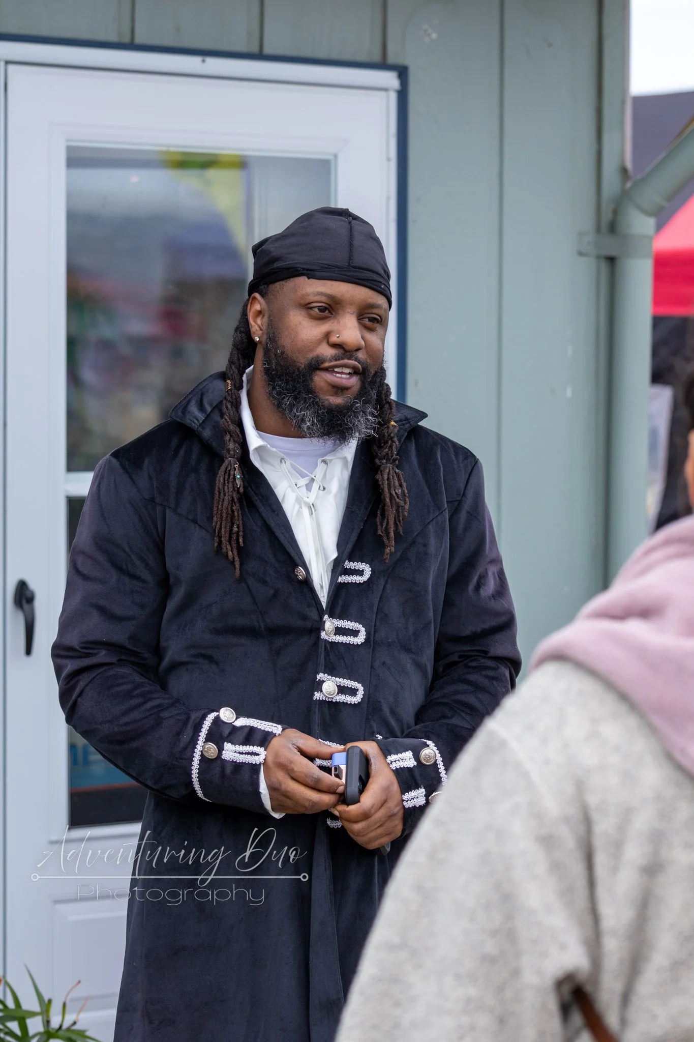 local business owner Jah of Whale of a Cone chatting it up with some people while dressed to impress in a pirate costume. Westport, WA