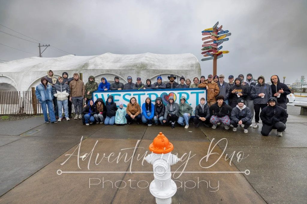 GHC Athletics teams that came to volunteer to hang lights and garland in the Westport Marina