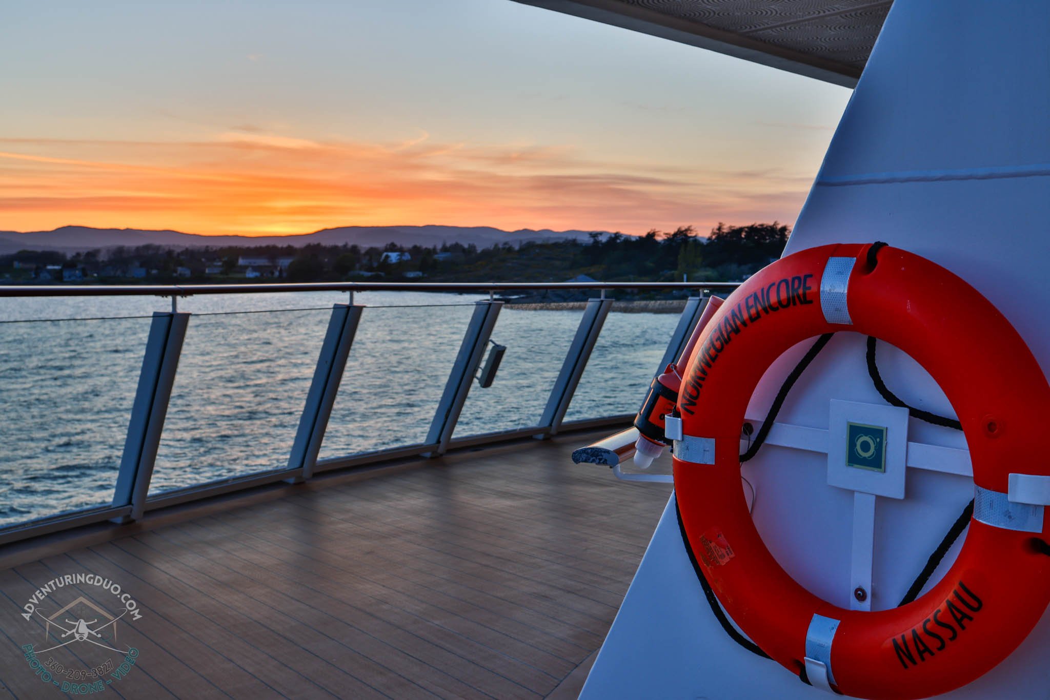 Life ring marked Norwegian Encore with sunset background
Brand-aligned shot capturing cruise safety detail and the peaceful end of day over Canadian waters.