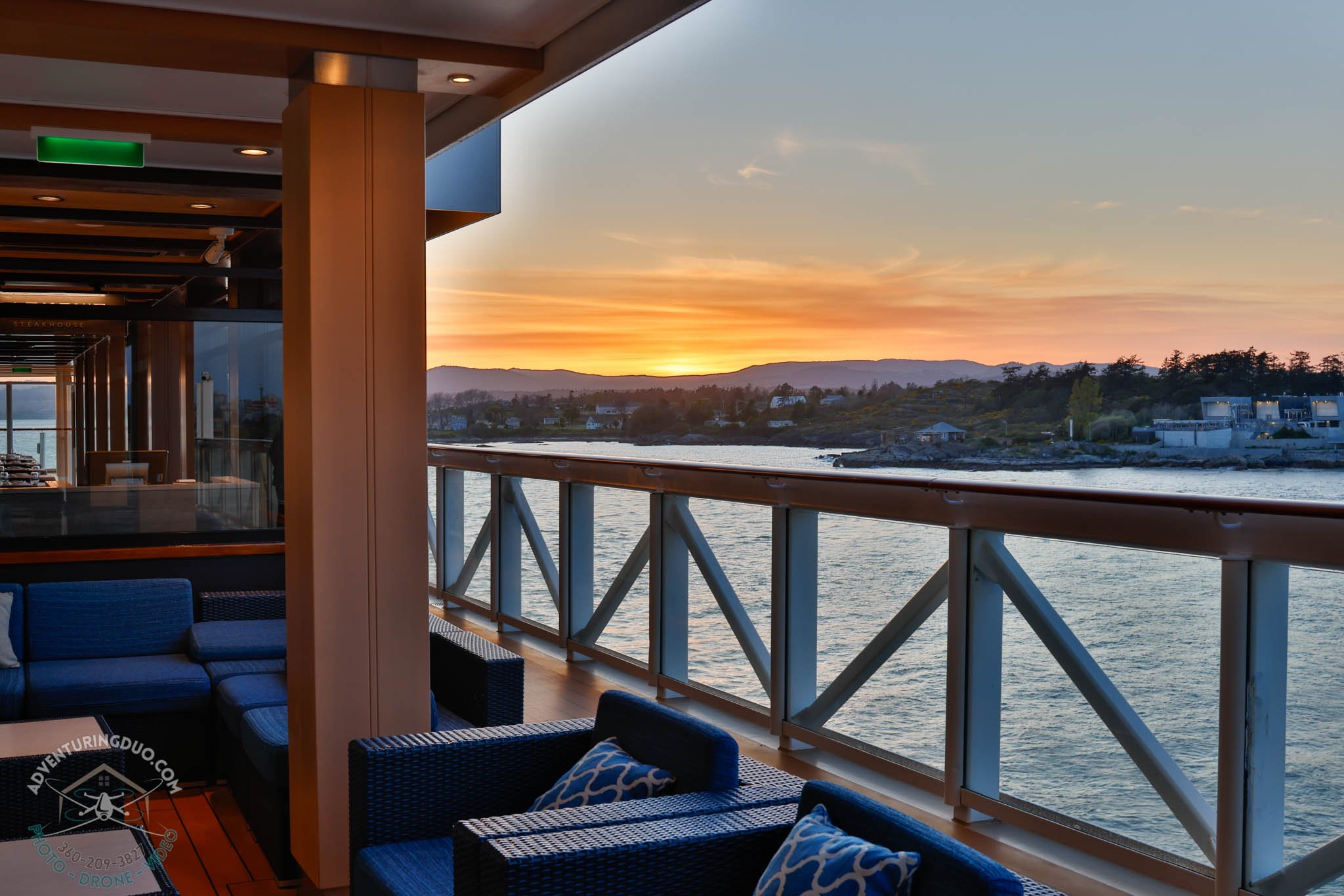 Covered lounge aboard Norwegian Encore at dusk
A cozy, peaceful space at sea photographed during sunset in Victoria, highlighting high-end cruise lifestyle.
