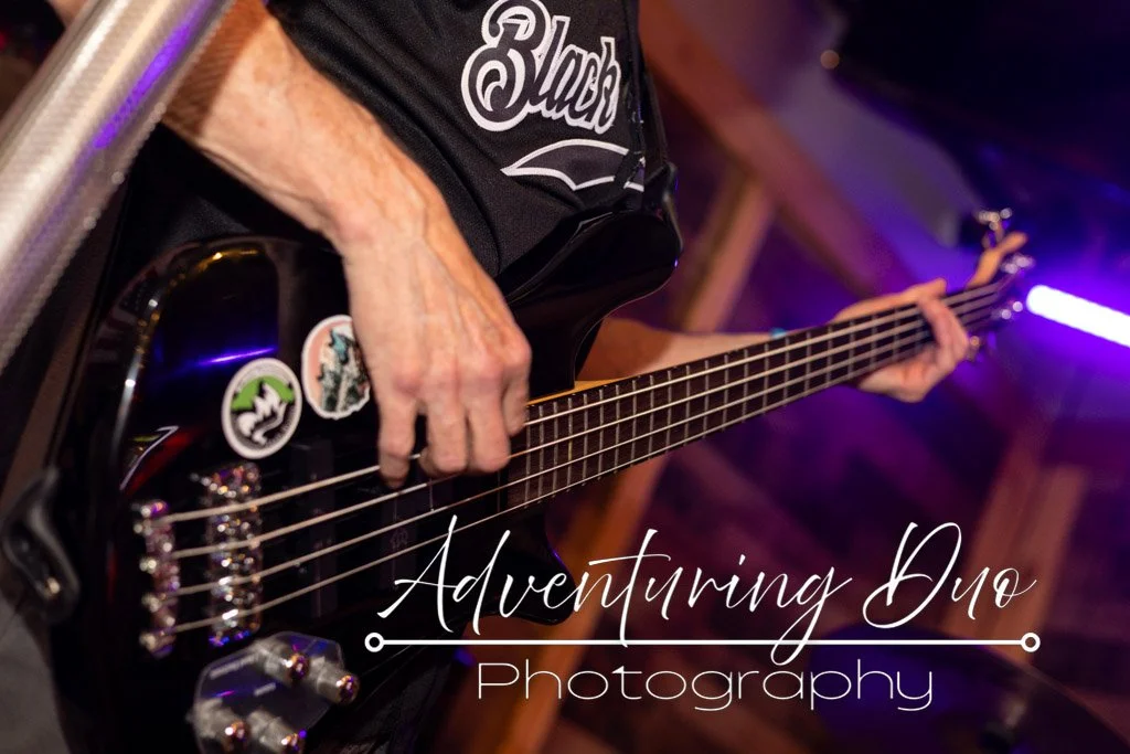 bass guitarist getting down with some chords and feeling the vibe