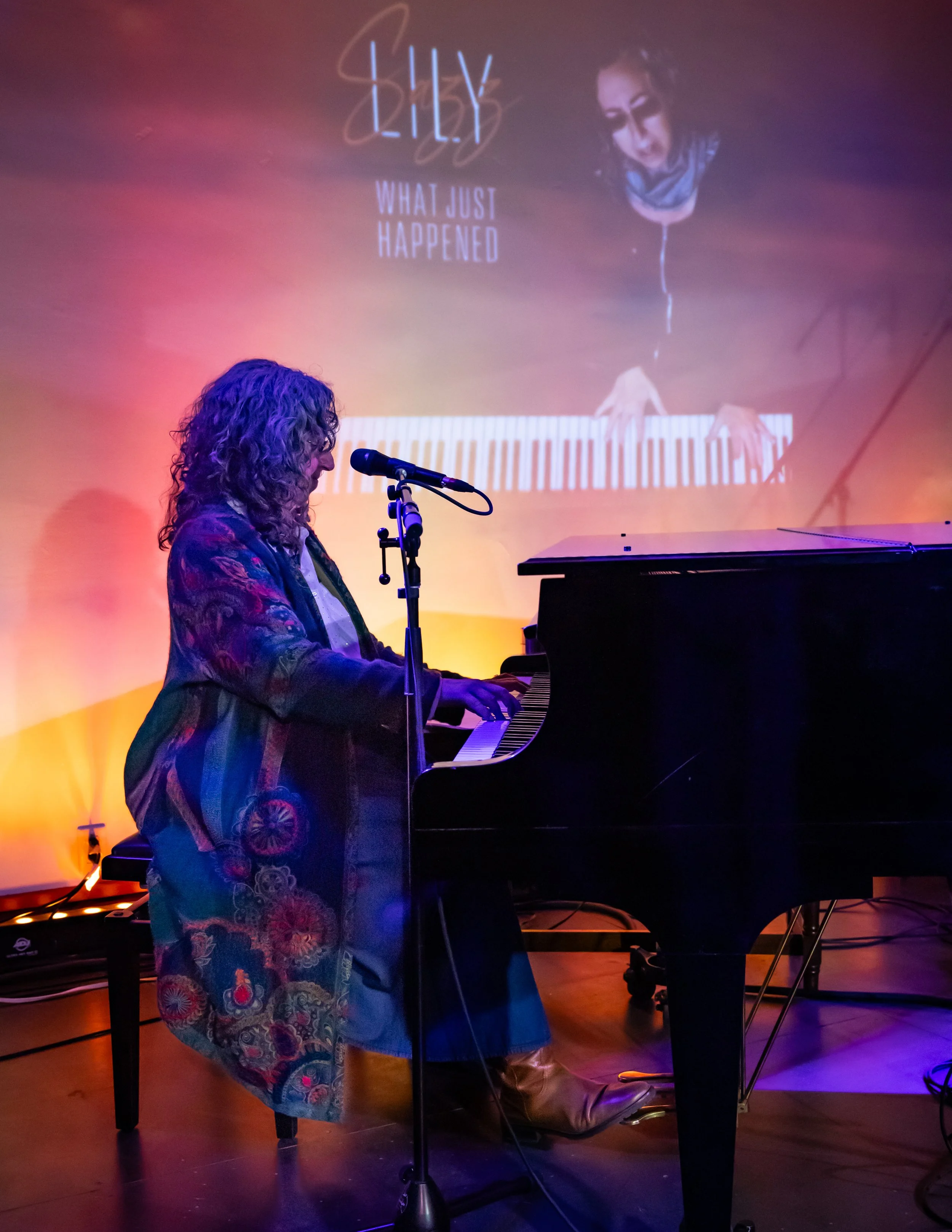 Lily Sazz performing on grand piano