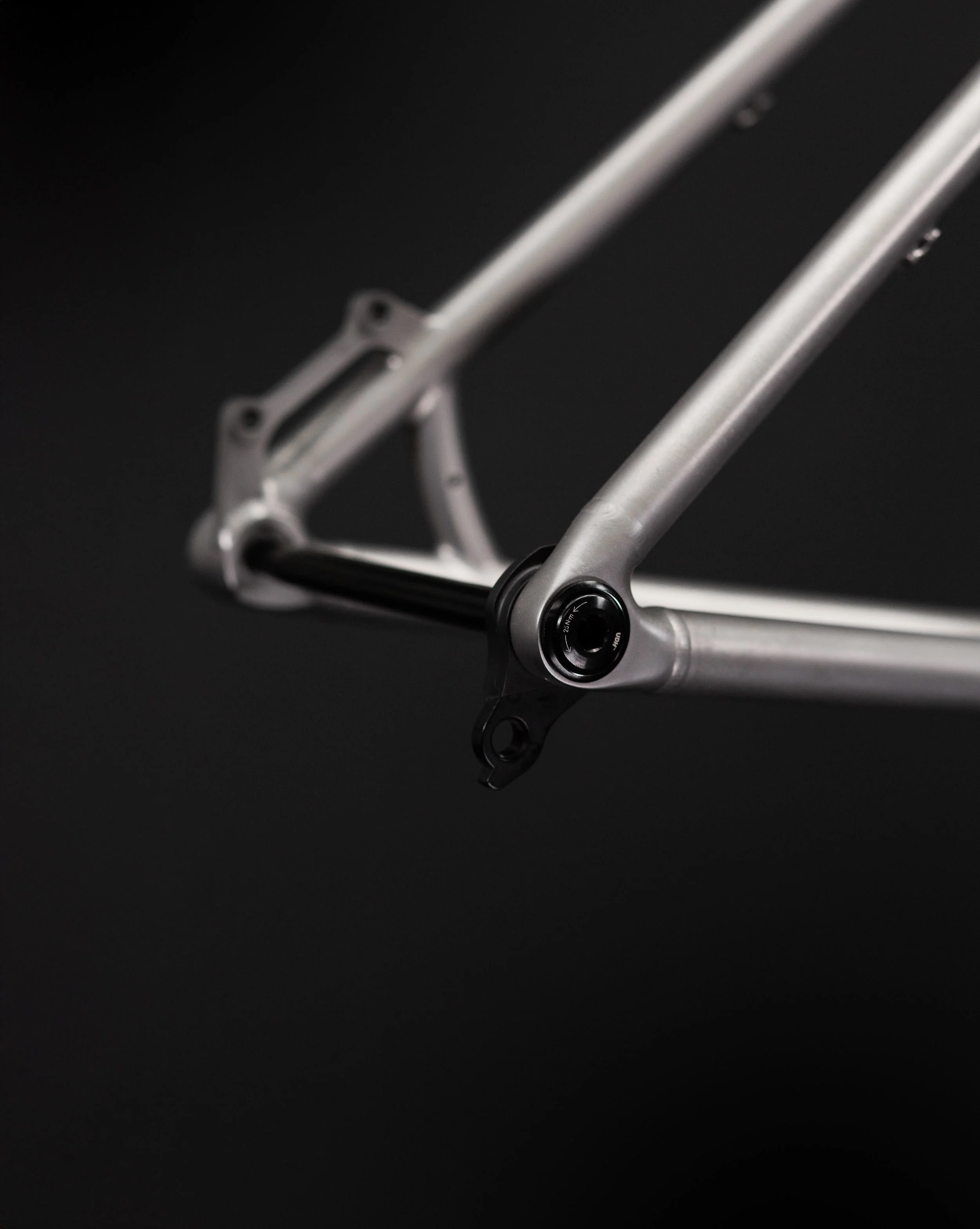 Detailed view of the 3D-printed titanium dropouts on the Method Frameworks Zapr frame, designed for durability and strength.