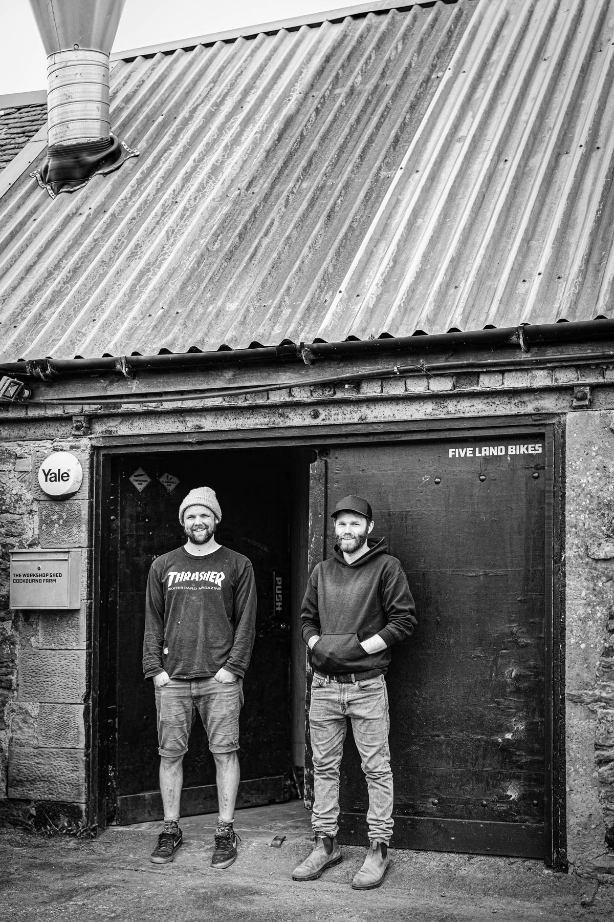 Owners of Five Land Bikes and Method Frameworks, standing outside of the original Five Land Bikes workshop.