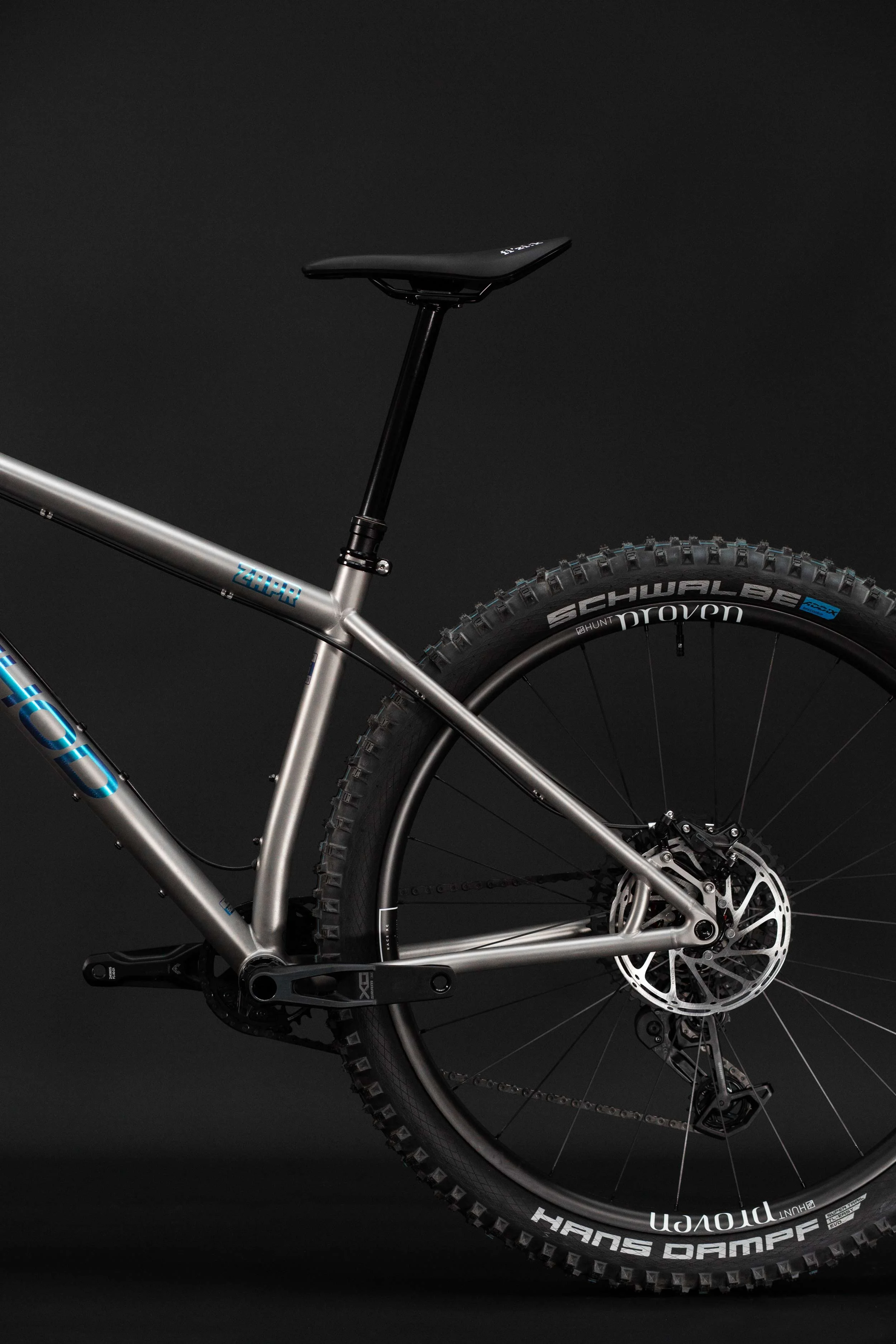 A full side profile of the Zapr titanium mountain bike frame, highlighting the sleek lines and lightweight build.