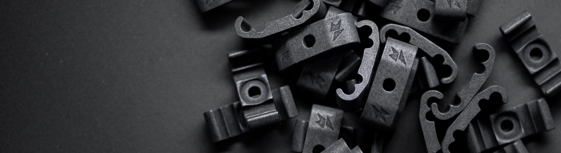 A bundle of black Method Framework's own cable guides