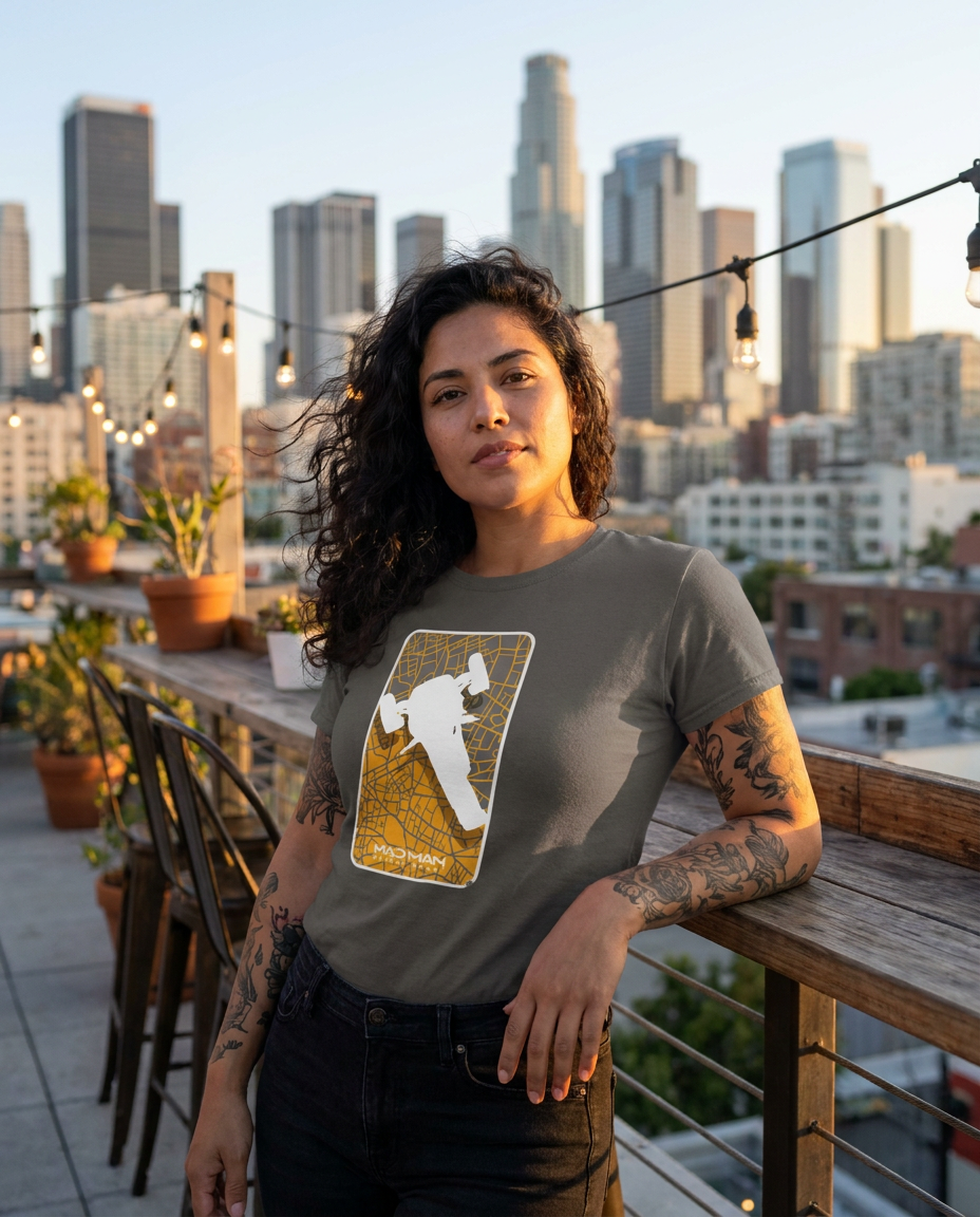 "Rooftop cafe interior with city skyline visual, model posing confidently in a white t shirt with @C.png