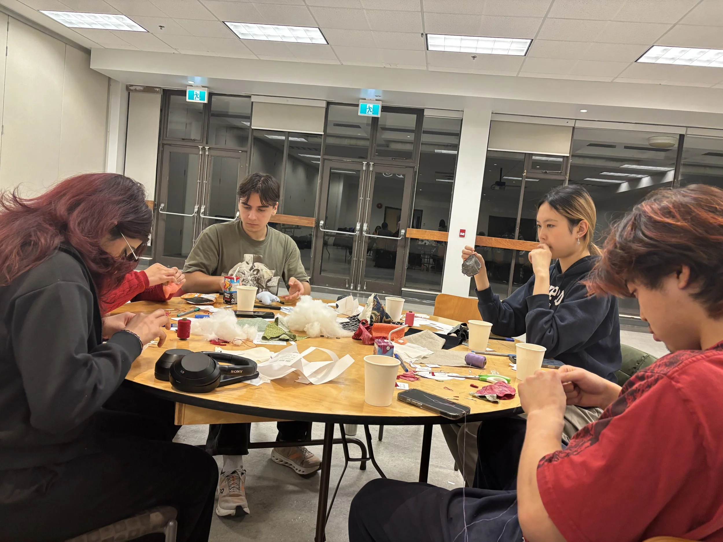 Participants exploring other ways to customize using upcycled fabrics.