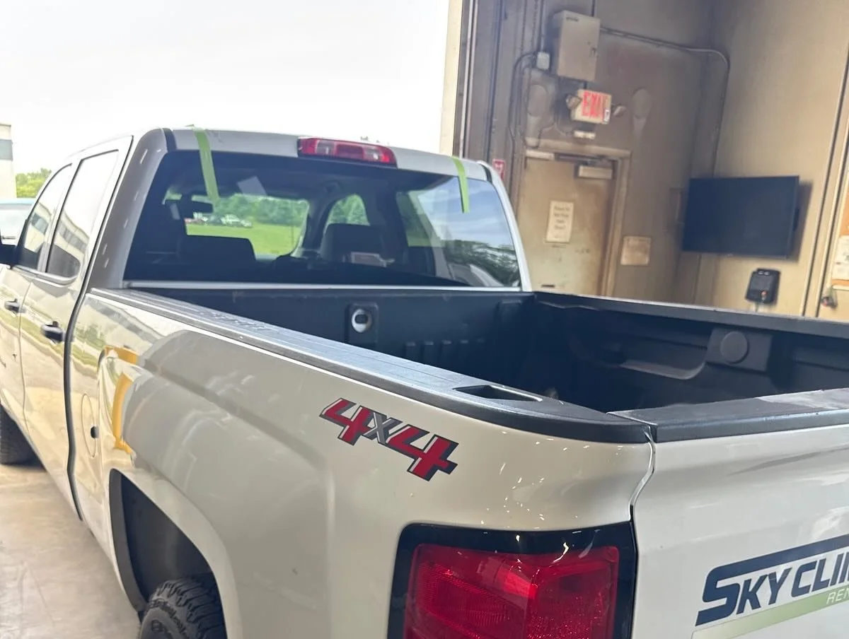 A completed back glass replacement on a pickup truck