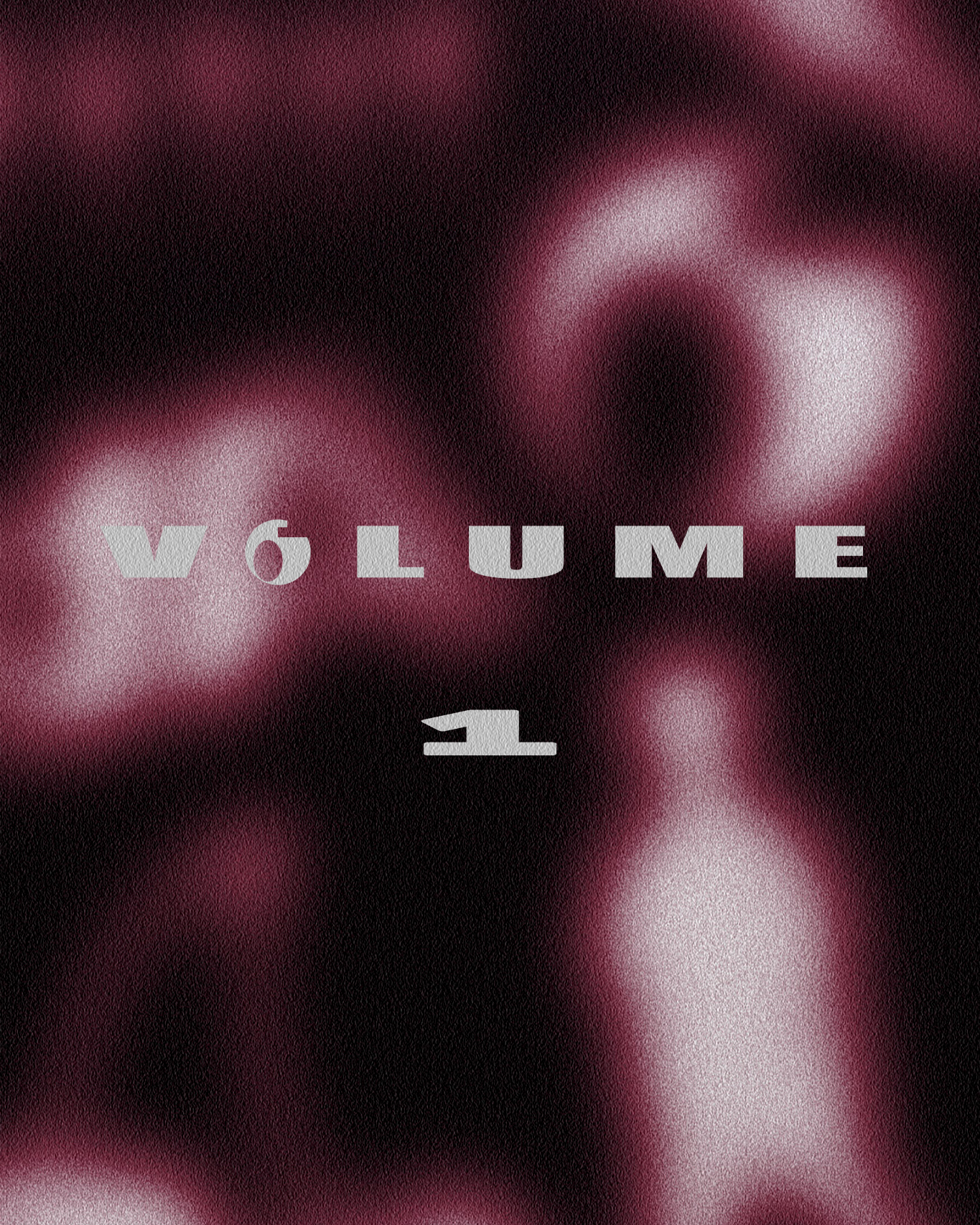 Blurred image with the text 'VOLUME 1' in bold, gray font over a dark background with pinkish highlights.