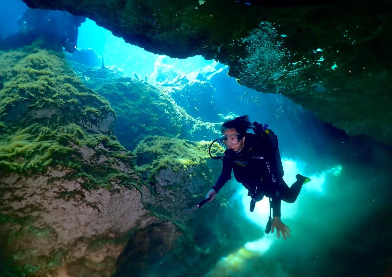 diver in a cavern in casa cenote