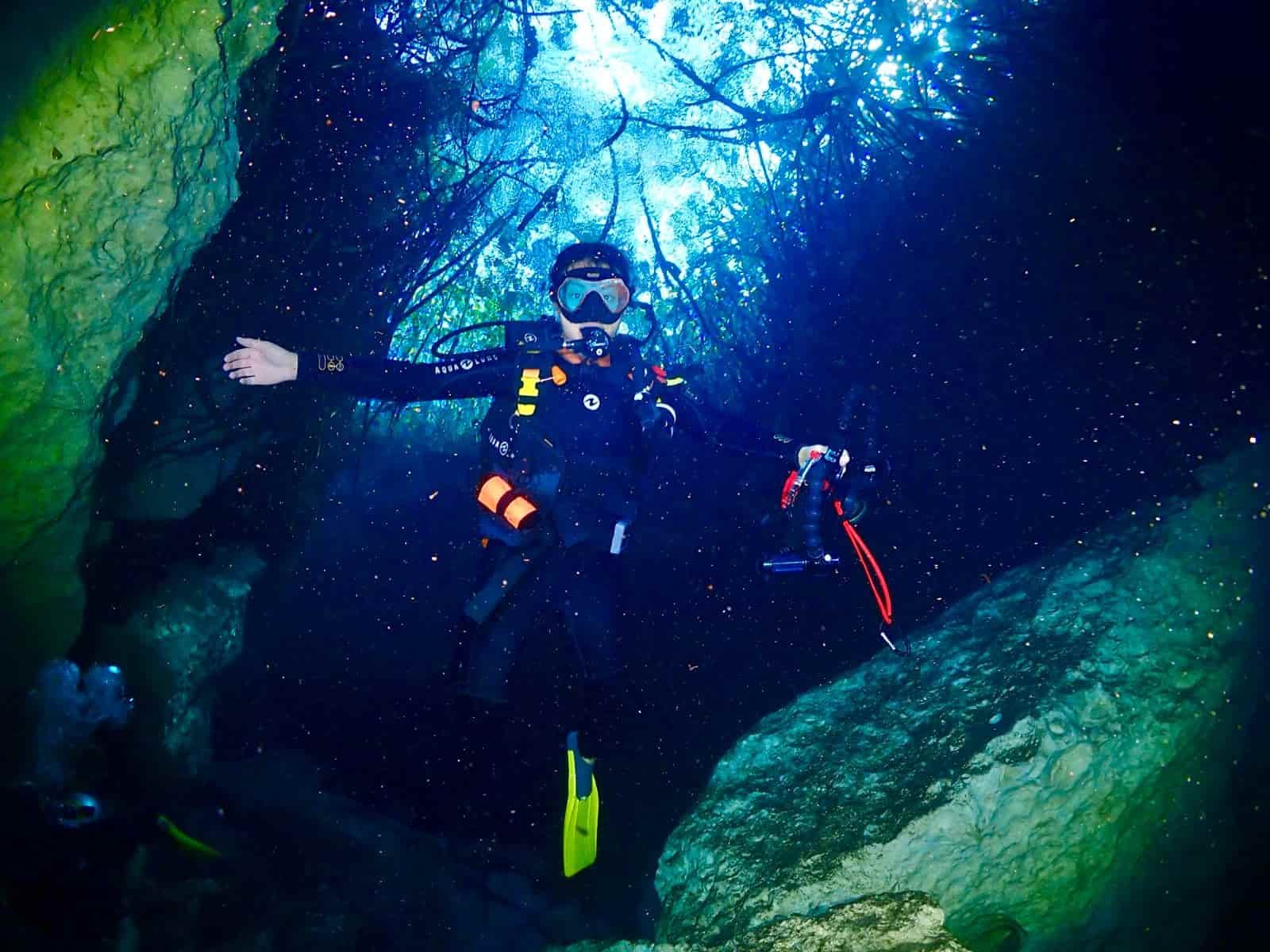Diver at crack passage casa cenote
