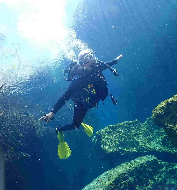 scuba diver at casa cenote practicing bouyancy skills