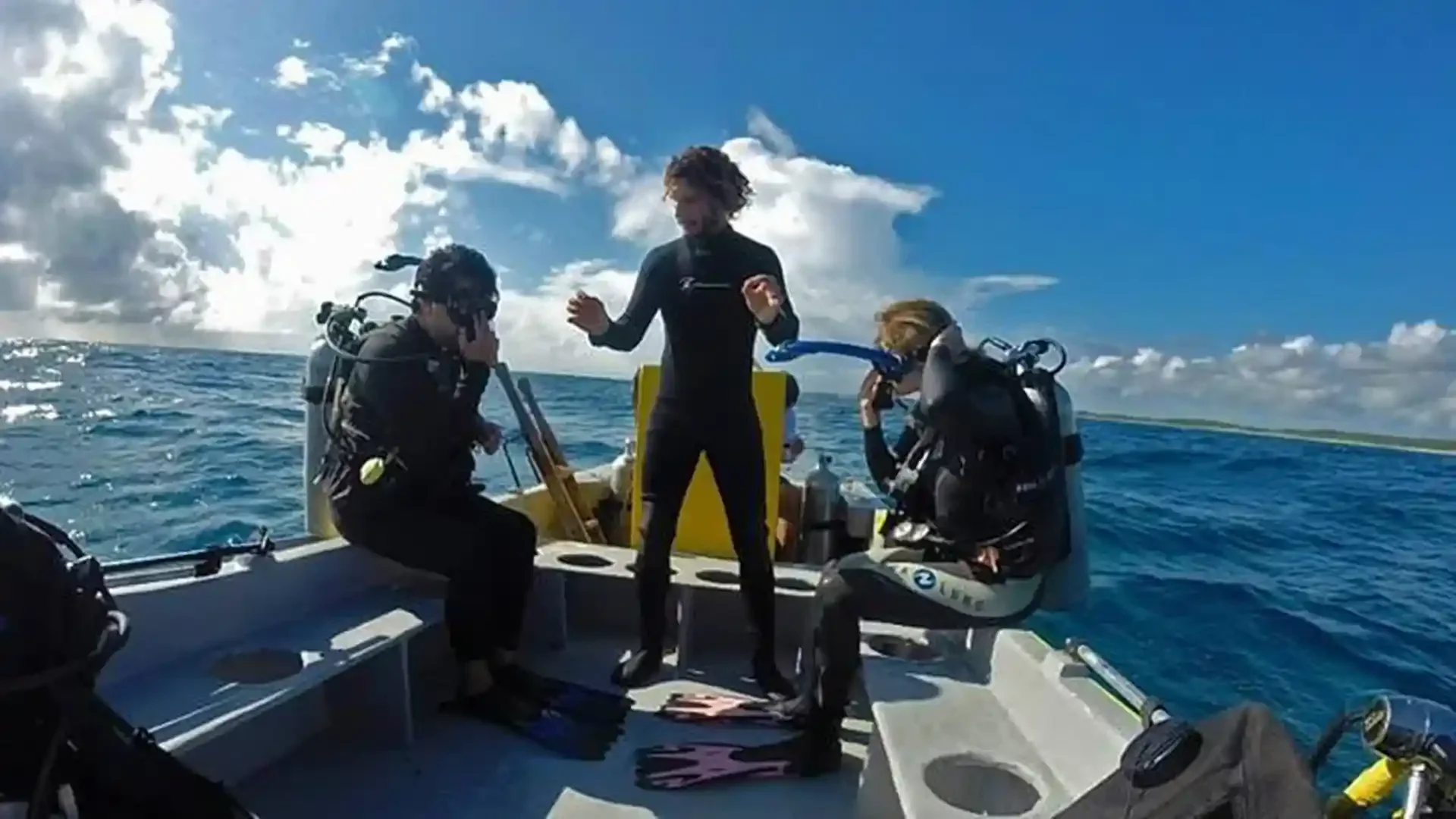 Mexidivers instructor giving a dive briefing on the boat during Divemaster training in Tulum