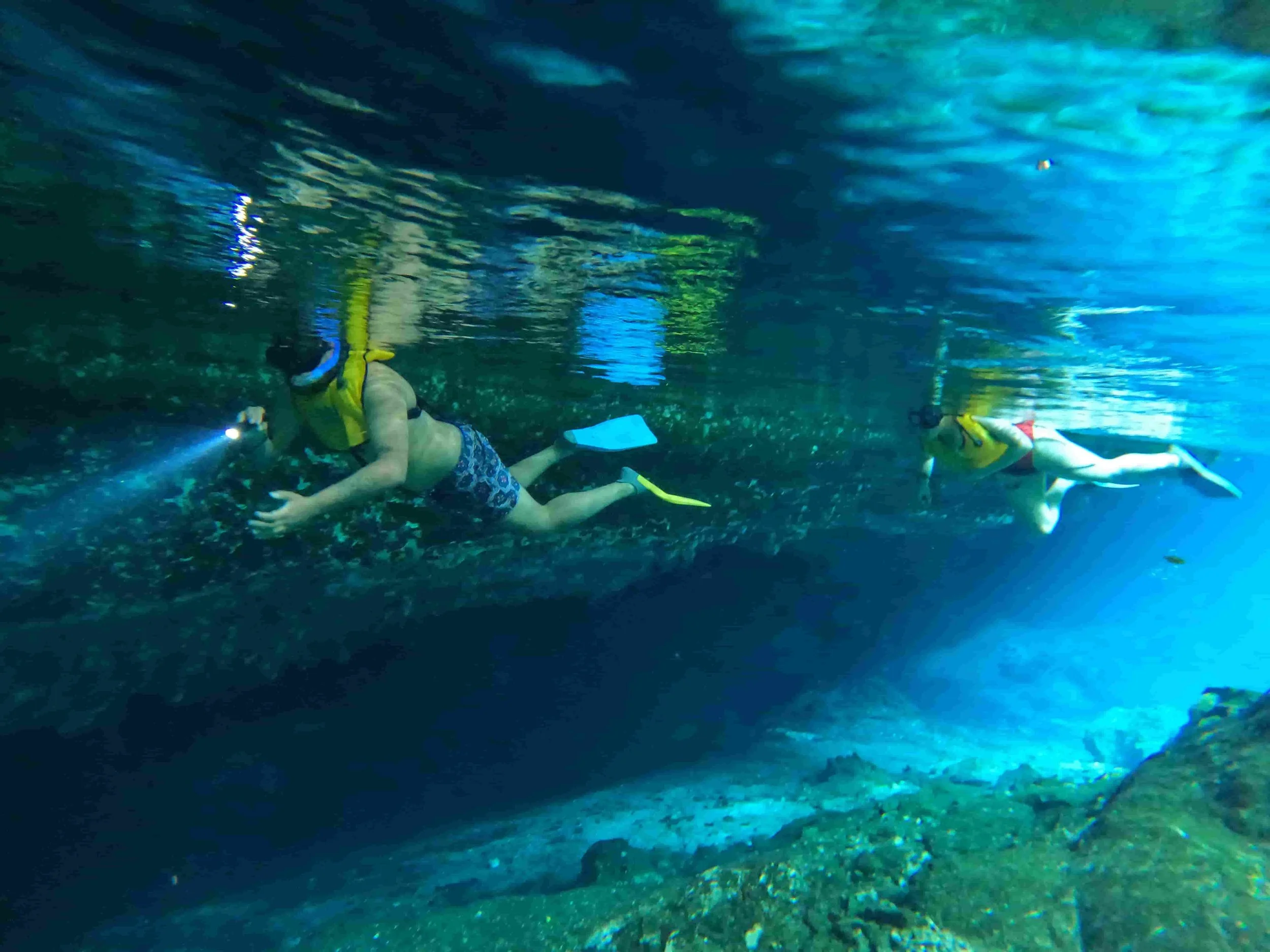 couple on a cenote snorkel tour in tulum mexico