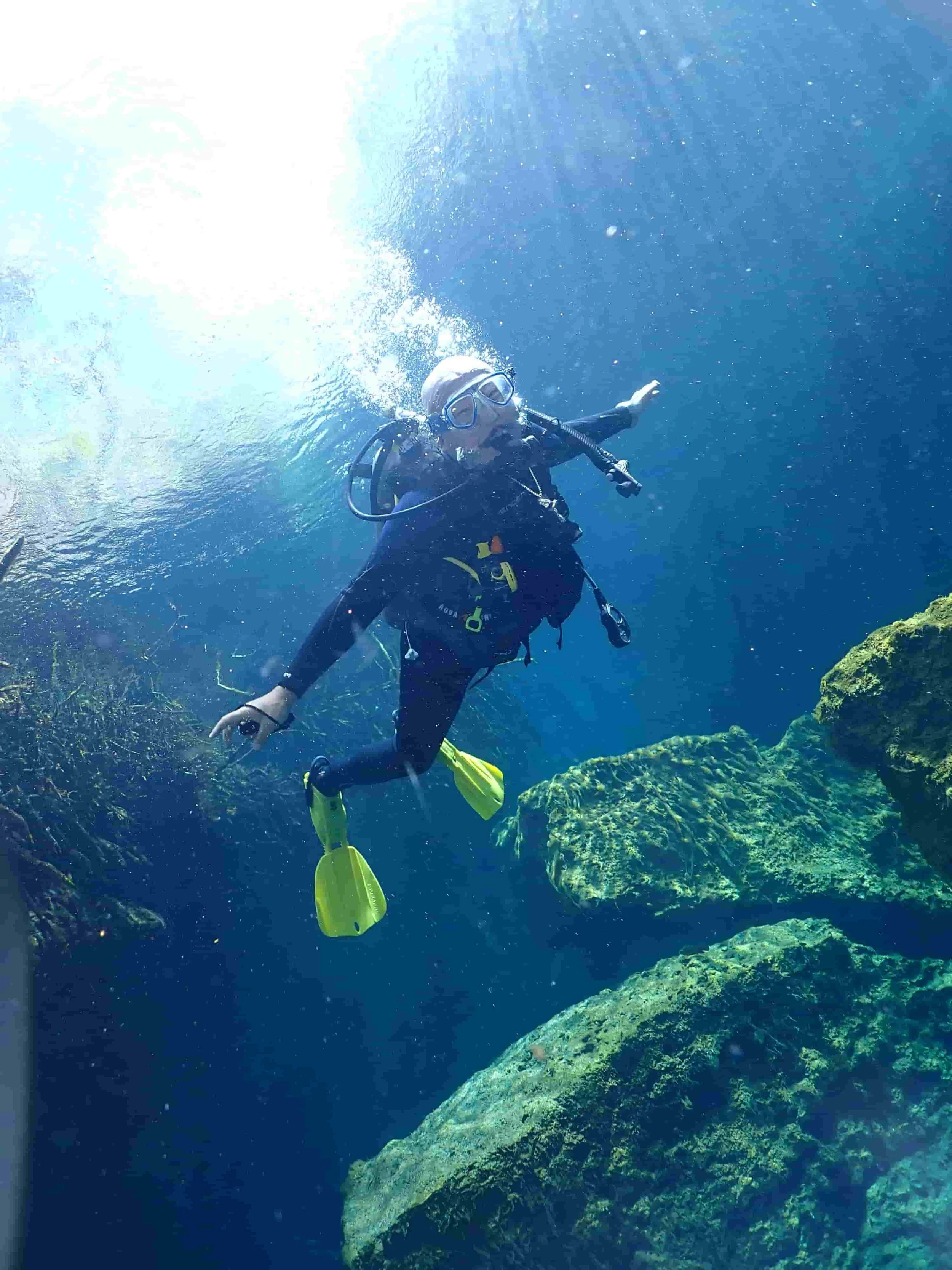 Discovery Diving in Casa Cenote for this first time diver practicing buoyancy in an open section 
