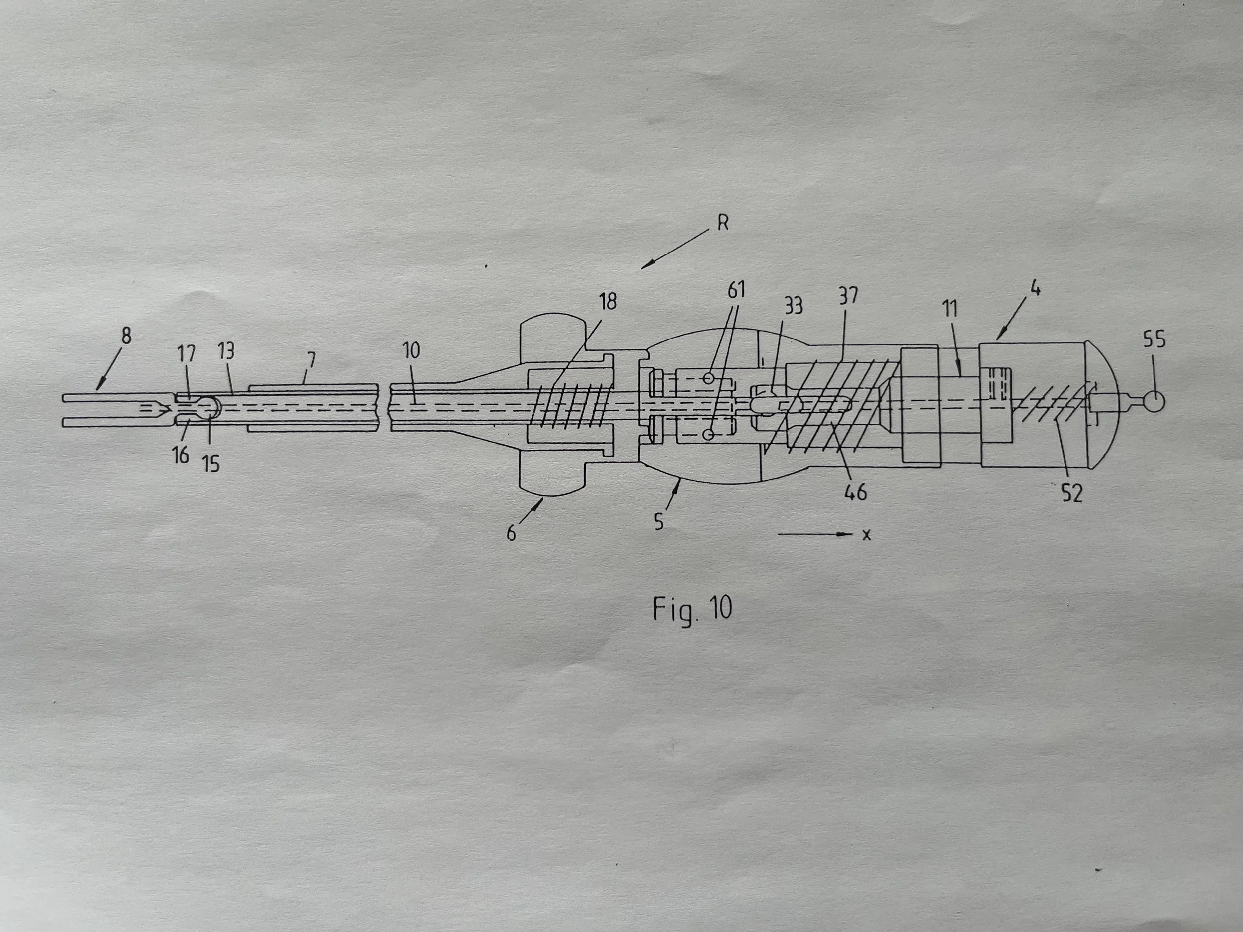 Technische Zeichnung eines mechanischen Geräts mit mehreren nummerierten Komponenten, Linien und Pfeilen, auf Papier gedruckt.