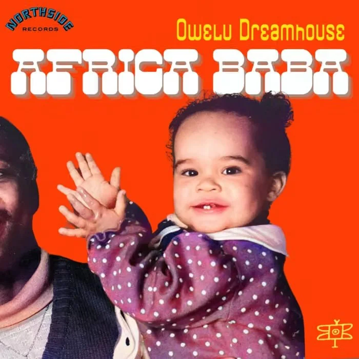 Album cover with a red background featuring a smiling child with curly hair and a woman, pointing upward. Text includes "Owelu Dreamhouse," "Reggae Baby," and "Northside Records."