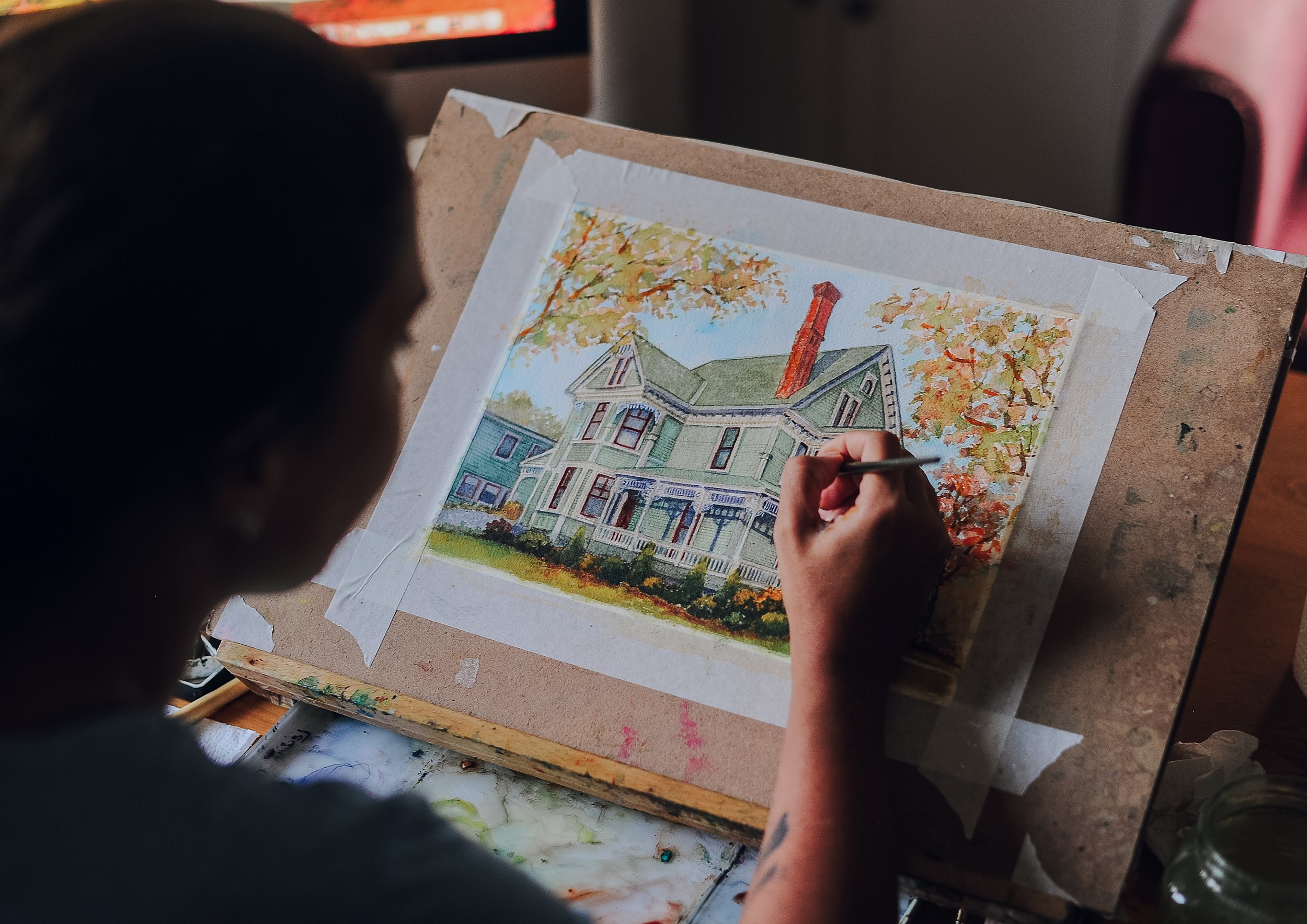 Naz from NzlStudio creating a custom house portrait