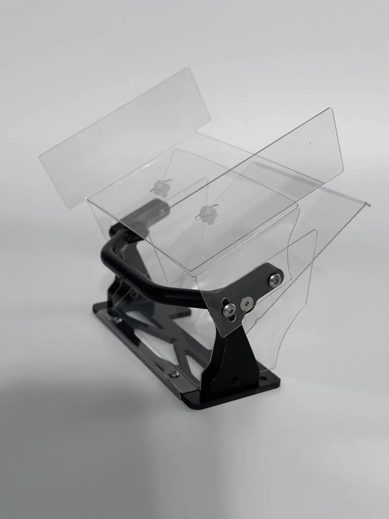 A clear plastic safety shield mounted on a black metal frame with a base, designed for protection, possibly for use in a laboratory or work environment.