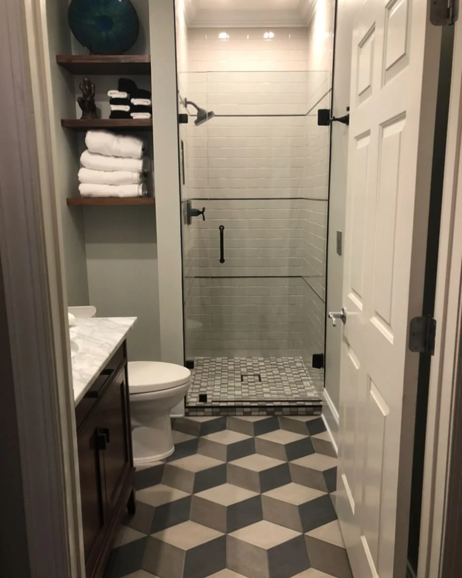 The #memorablemoment in this bathroom has to be the floor tile. Small bathrooms can hold patterns that might be overwhelming in a larger space. The floor pattern also adds a bit of mystery and movement to the space with its 3D effect. 

I also love d