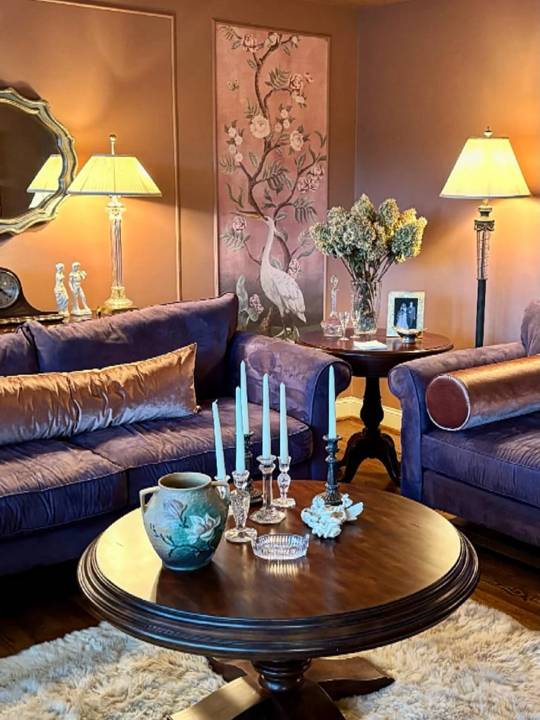 20+ year old eggplant colored sofas looked out of place in this room so we transformed the room to work with the sofas. 
- We started with a memorable moment and turned this @feathr_com wallpaper into art. 
- Selected the @sherwinwilliams Hushed Aubu