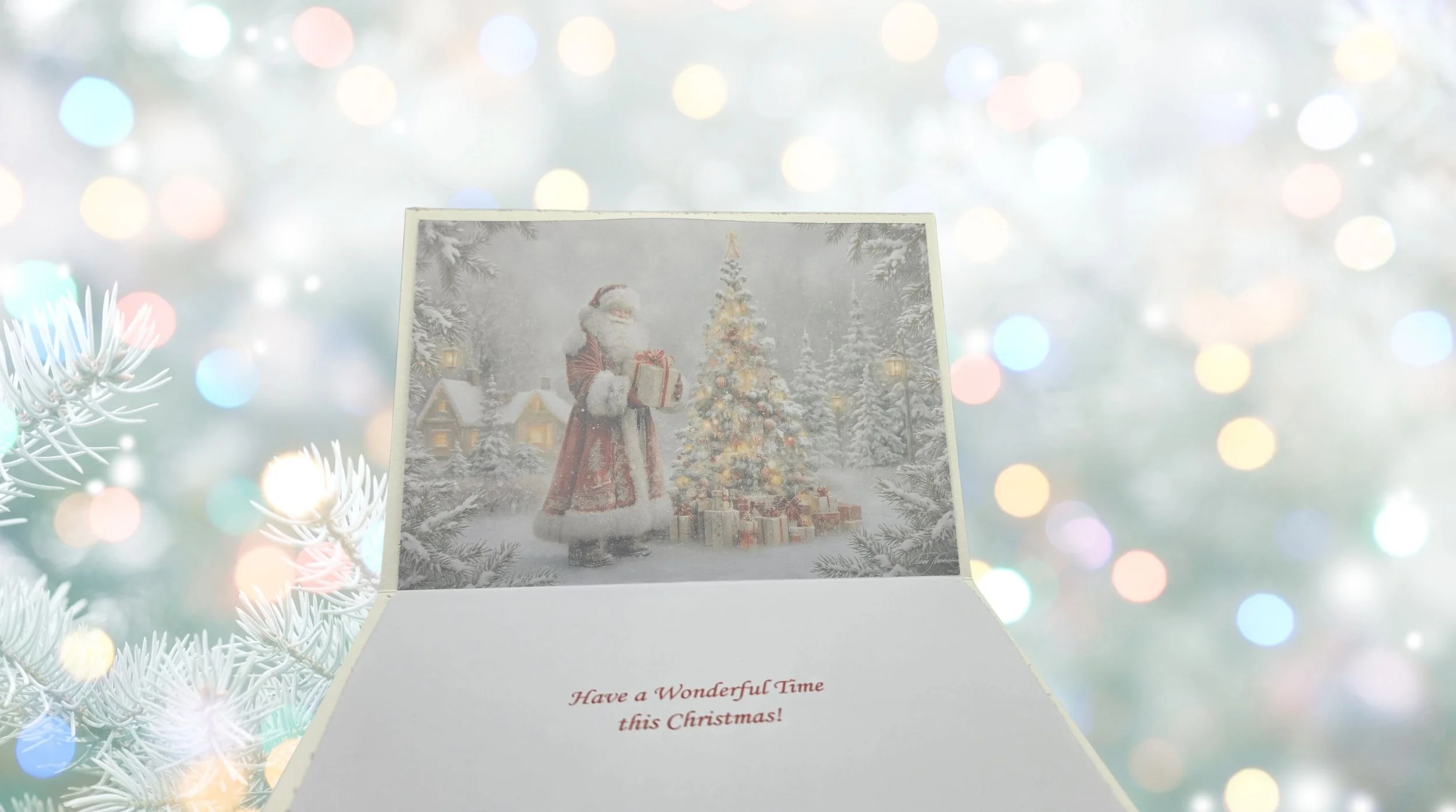 Open Christmas card showing internal printed message reading Have a Wonderful Time this Christmas! with Santa illustration on top..png