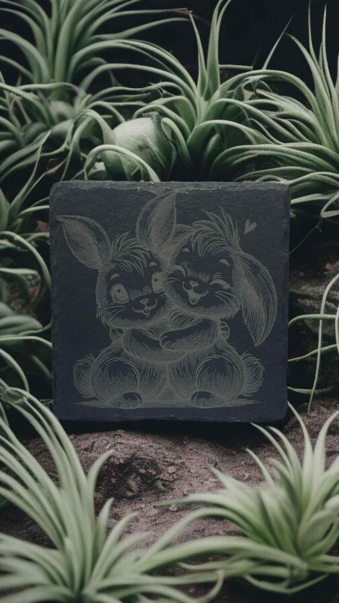 engraved slate coaster with two bunnies hugging uncoated