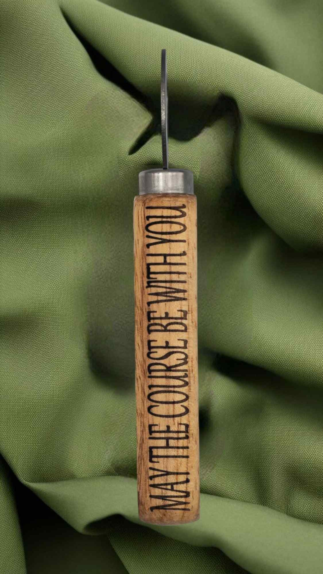wooden bottle opener engraved with may the course be with you text