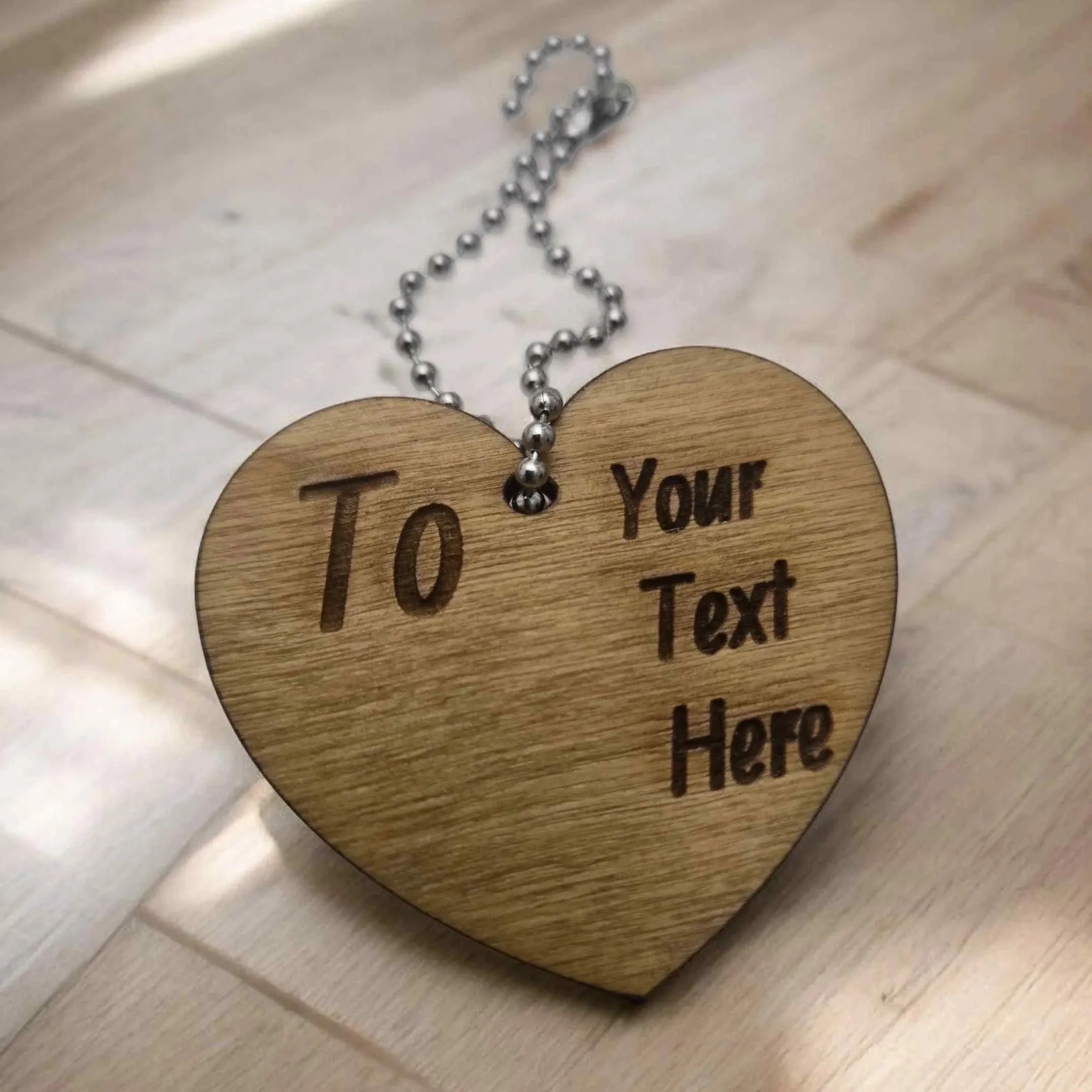 Personalised laser-engraved guitar heart tag—British handcrafted gift.