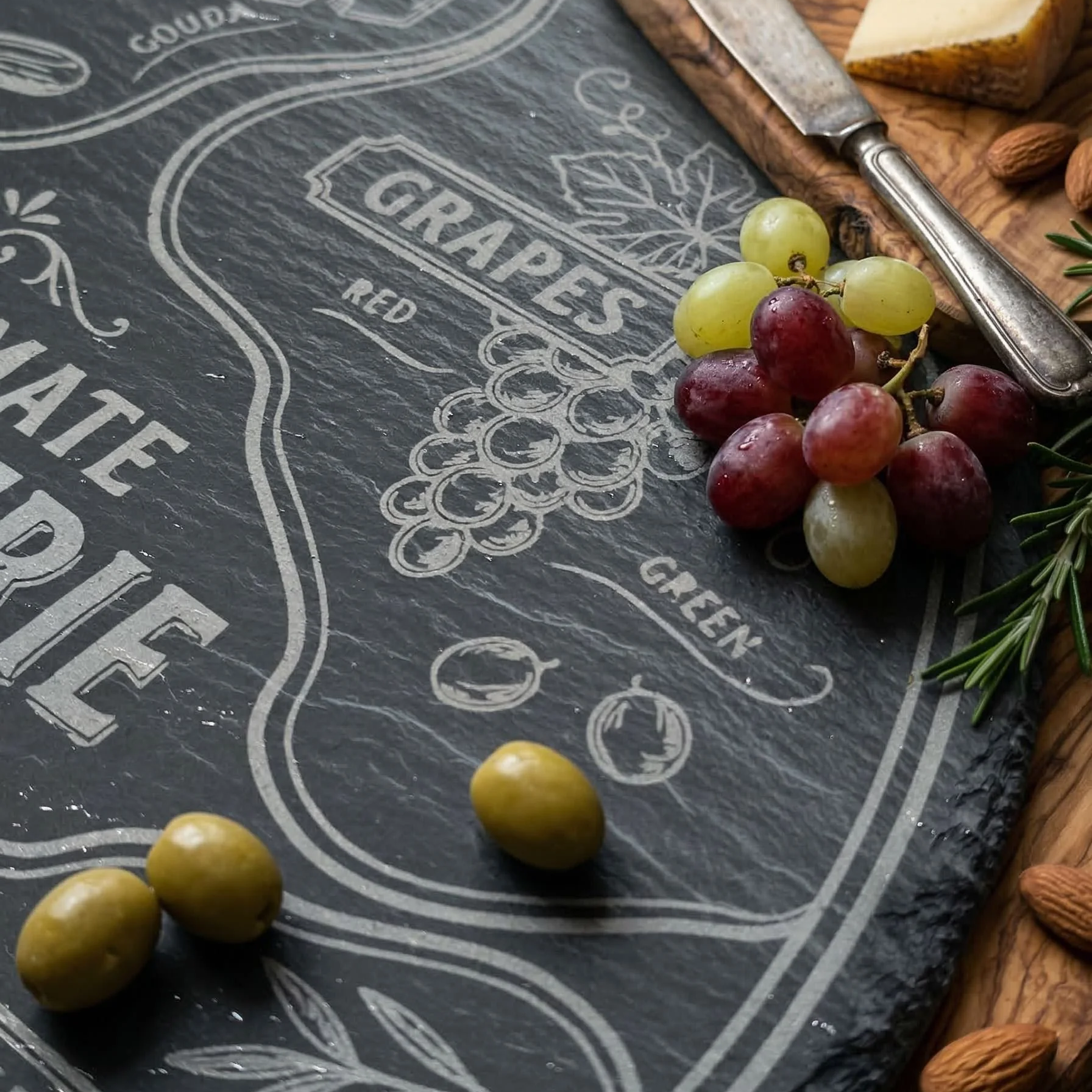 Close-up+of+intricate+laser+engravings+featuring+grapes.png