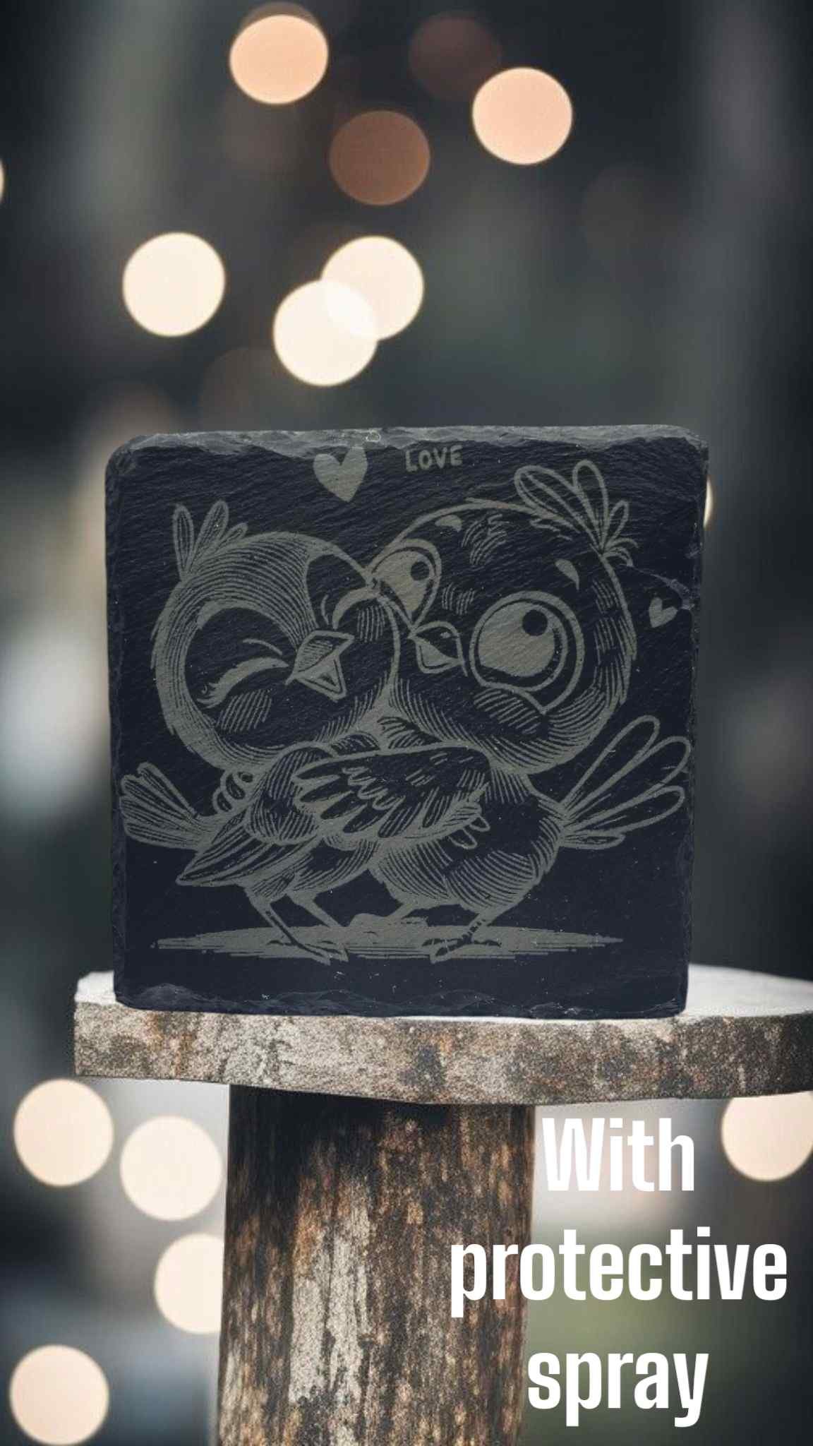 slate engraved coaster of birds cuddling each other coated