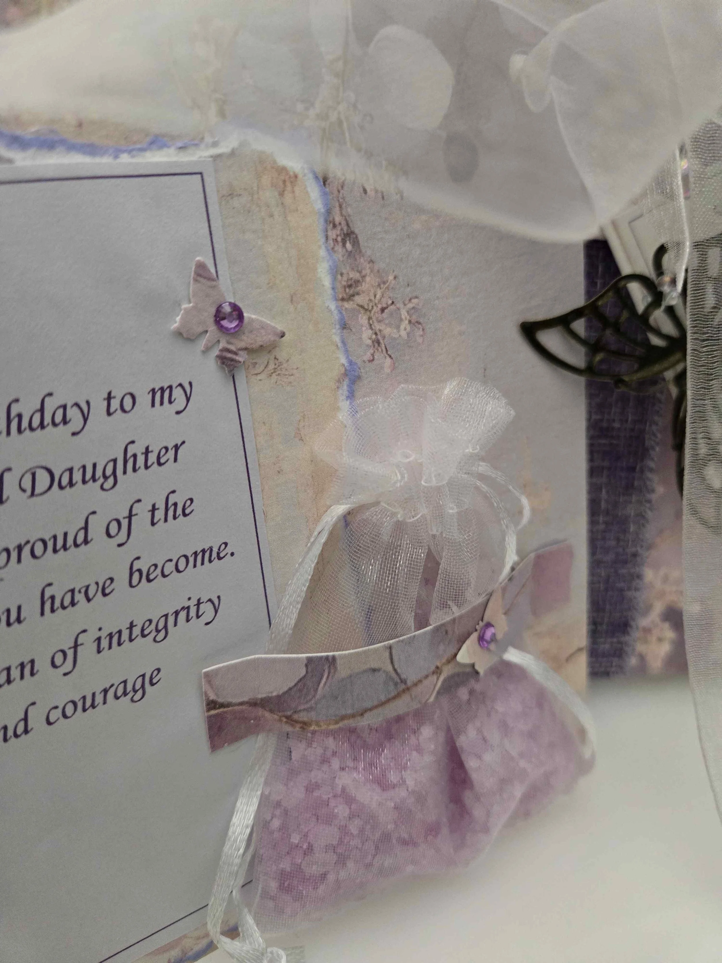 Inside view of a freestanding present card showing the message section and scented organza bag.