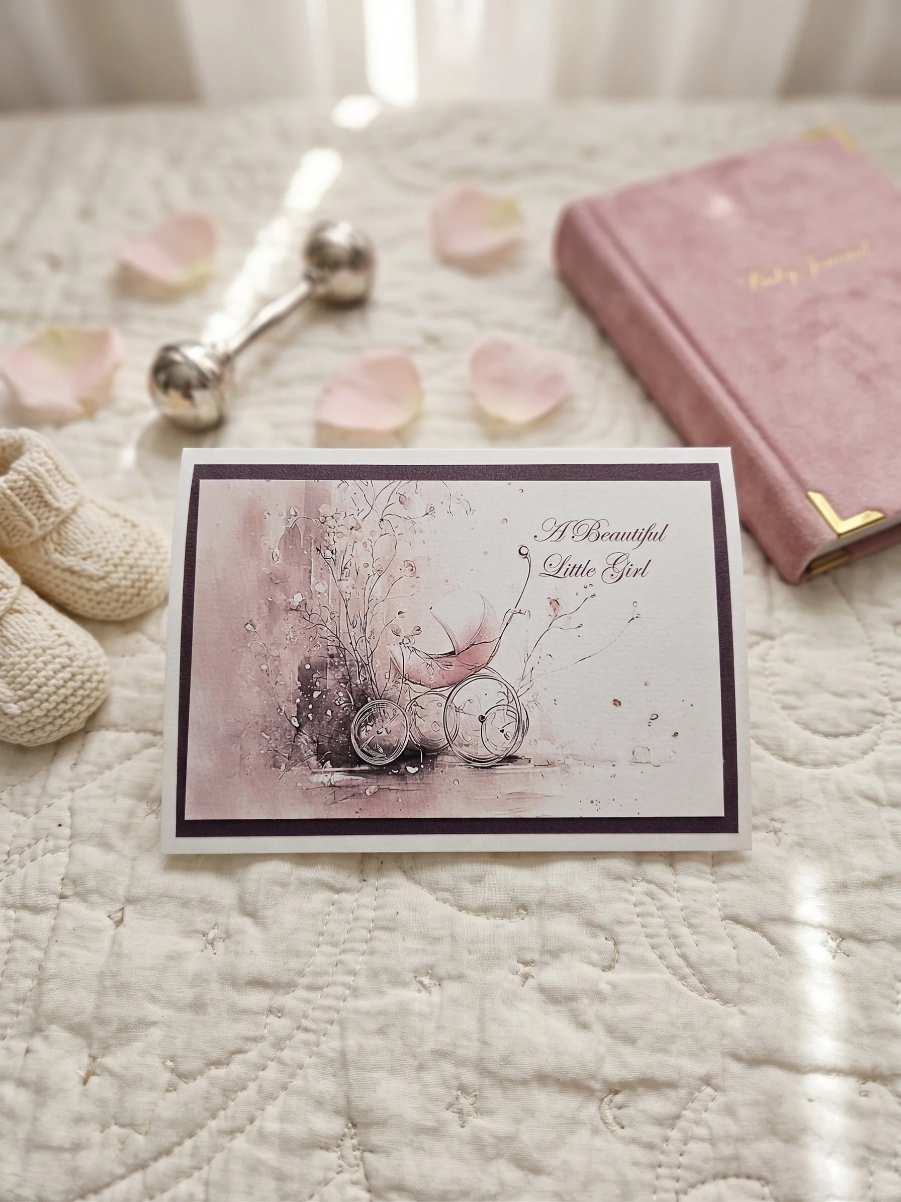 Handmade pink girls pram card on white linen.jpg